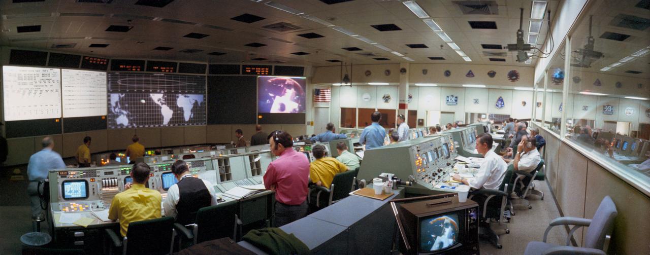 S71-17122 (31 Jan. 1971) --- A wide angle overall view of the Mission Operations Control Room (MOCR) in the Mission Control Center at the Manned spacecraft Center. This view was photographed during the first color television transmission from the Apollo 14 Command Module. Projected on the large screen at the right front of the MOCR is a view of the Apollo 14 Lunar Module, still attached to the Saturn IVB stage. The Command and Service Modules were approaching the LM/S-IVB during transposition and docking maneuvers.