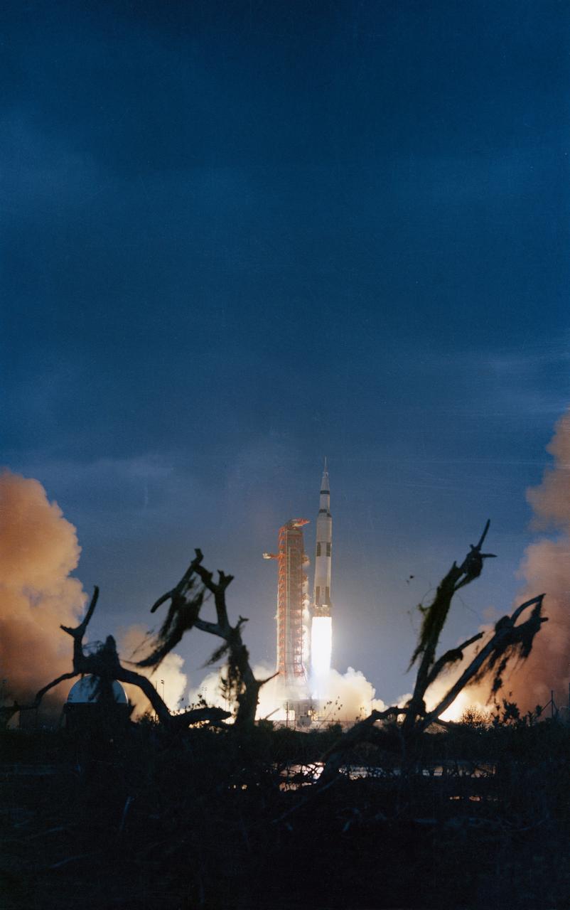 S71-18399 (31 Jan. 1971) --- The huge, 363-feet tall Apollo 14 (Spacecraft 110/Lunar Module 8/Saturn 509) space vehicle is launched from Pad A, Launch Complex 39, Kennedy Space Center (KSC), Florida at 4:03:02 p.m. (EST), Jan. 31, 1971, on a lunar landing mission. This view is framed by moss-covered dead trees in the dark foreground. Aboard the Apollo 14 spacecraft were astronauts Alan B. Shepard Jr., commander; Stuart A. Roosa, command module pilot; and Edgar D. Mitchell, lunar module pilot.