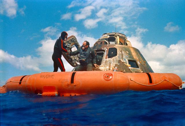 NASA image: Apollo 14 astronauts assisted out of Command Module by Navy divers