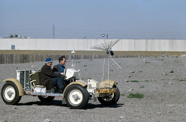 Astronaut John Young drives in One-G Lunar Roving Vehicle during simulation