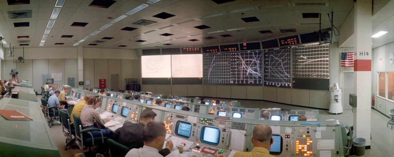 S71-41357 (26 July 1971) --- An overall, wide-angle lens view of activity in the Mission Operations Control Room in the Mission Control Center minutes after the launch of the Apollo 15 lunar landing mission. Ground elapsed time was 45 minutes and 42 seconds when this photograph was taken.