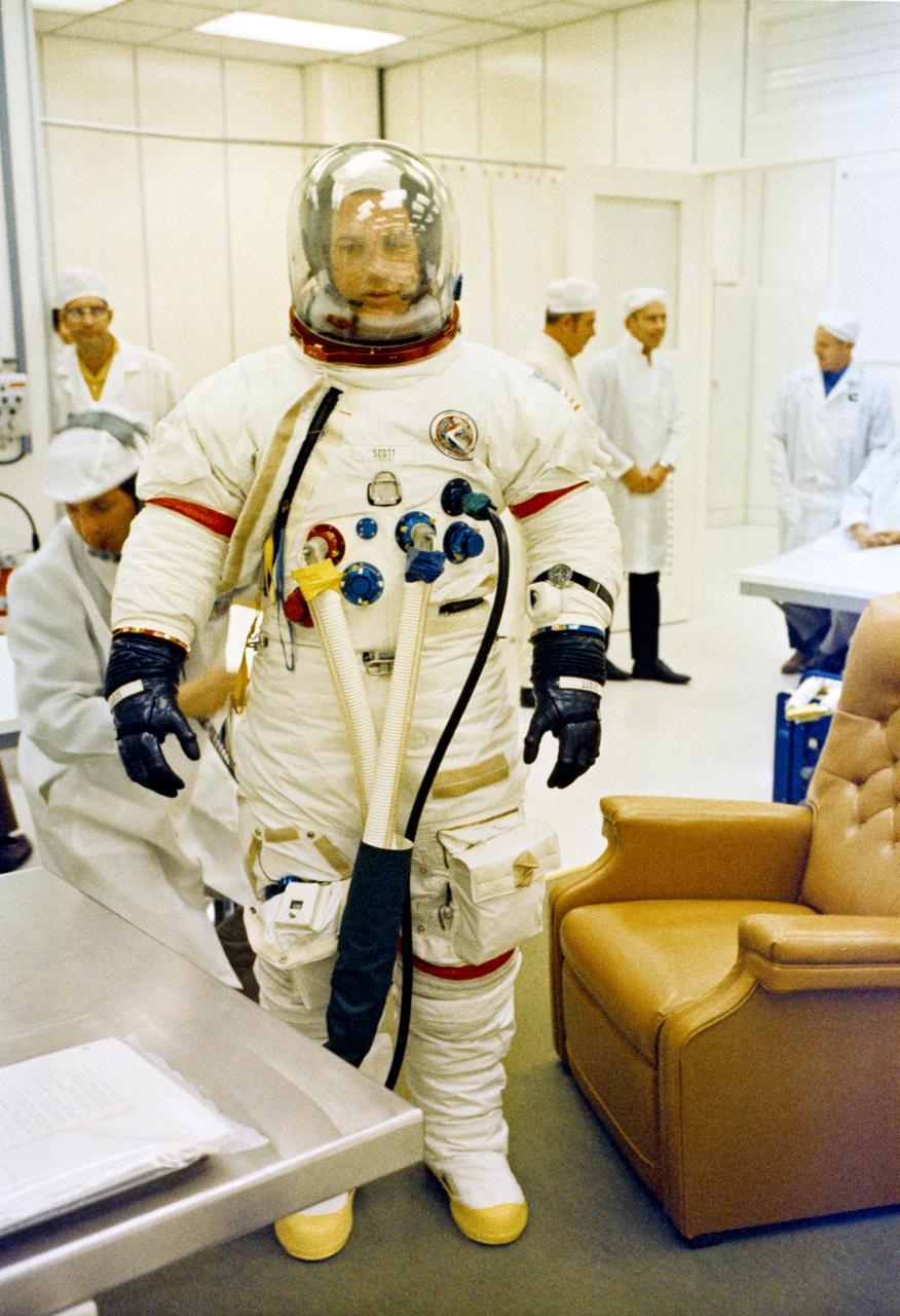 S71-41409 (26 July 1971) --- Astronaut David R. Scott, commander of the Apollo 15 lunar landing mission, goes through suiting up operations in the Kennedy Space Center's (KSC) Manned Spacecraft Operations Building (MSOB) during the Apollo 15 prelaunch countdown. Minutes later astronauts Scott; Alfred M. Worden, command module pilot; and James B. Irwin, lunar module pilot, rode a special transport van over to Pad A, Launch Complex 39, where their spacecraft awaited them. The Apollo 15 space vehicle was launched at 9:34:00:79 a.m. (EDT), July 26, 1971.