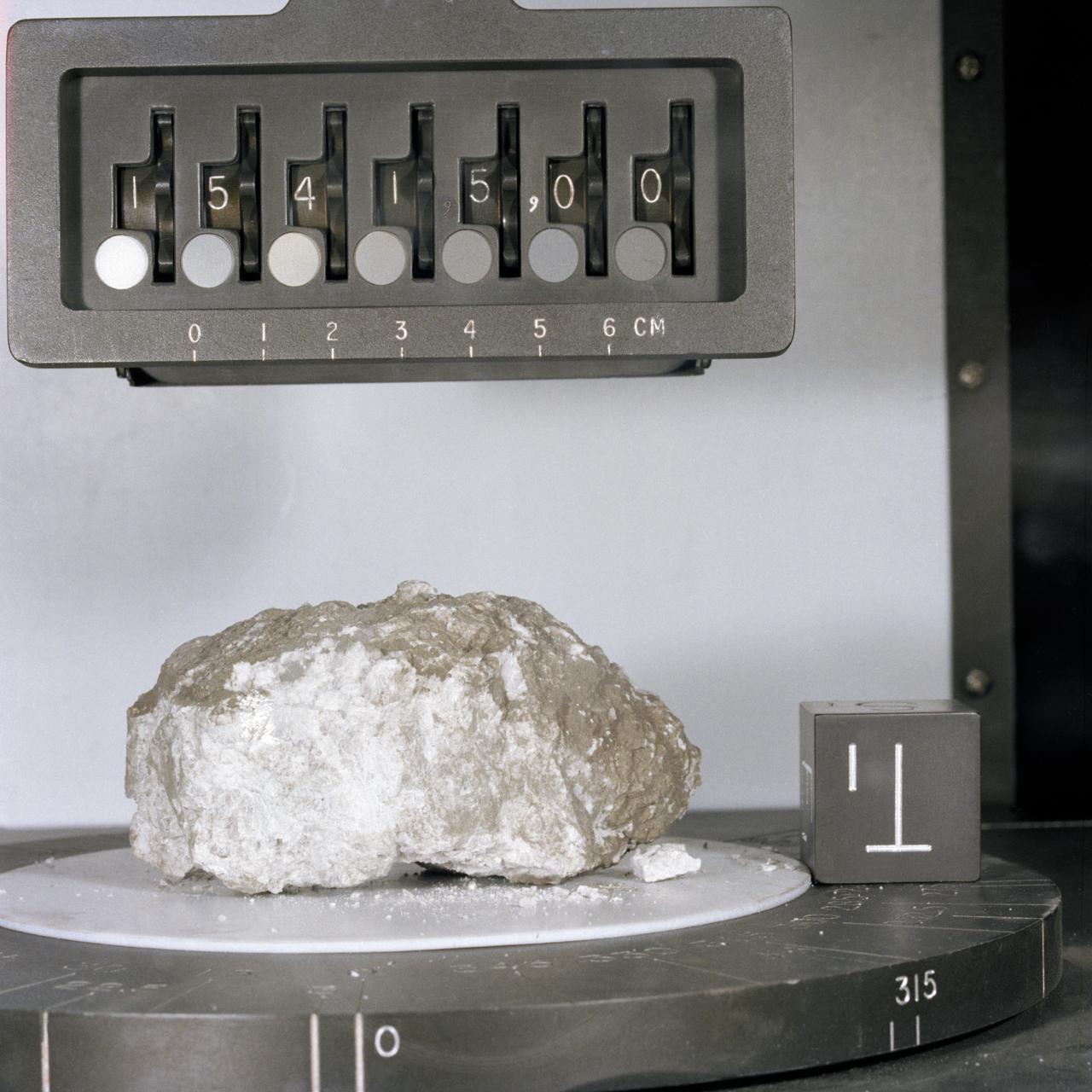 S71-42955 (August 1971) --- A close-up view of Apollo 15 lunar sample no. 15415 in the Non-Sterile Nitrogen Processing Line (NNPL) in the Lunar Receiving Laboratory (LRL) at the Manned Spacecraft Center (MSC). This sample is the white anorthositic rock (Genesis Rock) collected by astronauts David R. Scott and James B. Irwin in container no. 196 at Site no. 7 at a Ground Elapsed Time of 145 hours and 42 minutes, on the mission's second extravehicular activity (EVA).