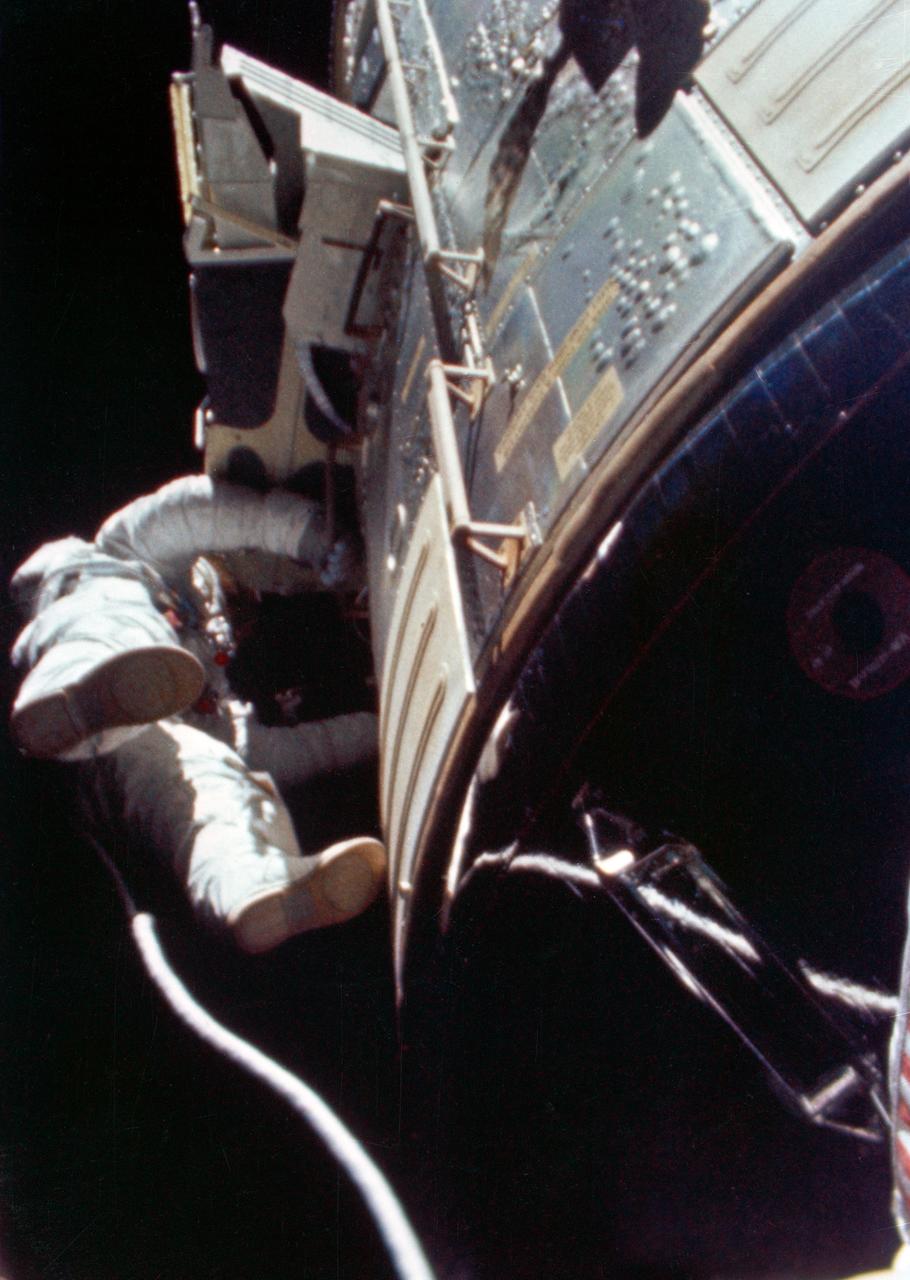 S71-43202 (5 Aug. 1971) --- Astronaut Alfred M. Worden, command module pilot of the Apollo 15 lunar landing mission, floats in space outside the spacecraft during his trans-Earth extravehicular activity (EVA). This photograph was taken from a frame of motion picture film exposed by the 16mm Maurer camera mounted in the hatch of the Command Module (CM). During his EVA, Worden made an inspection of the Service Module's (SM) Scientific Instrument Module (SIM) bay and retrieved the film cassettes from the Panoramic Camera and the Mapping Camera. The SIM bay holds eight orbital science experiments. The EVA occurred when the spacecraft was homeward bound approximately 171,000 nautical miles from Earth.