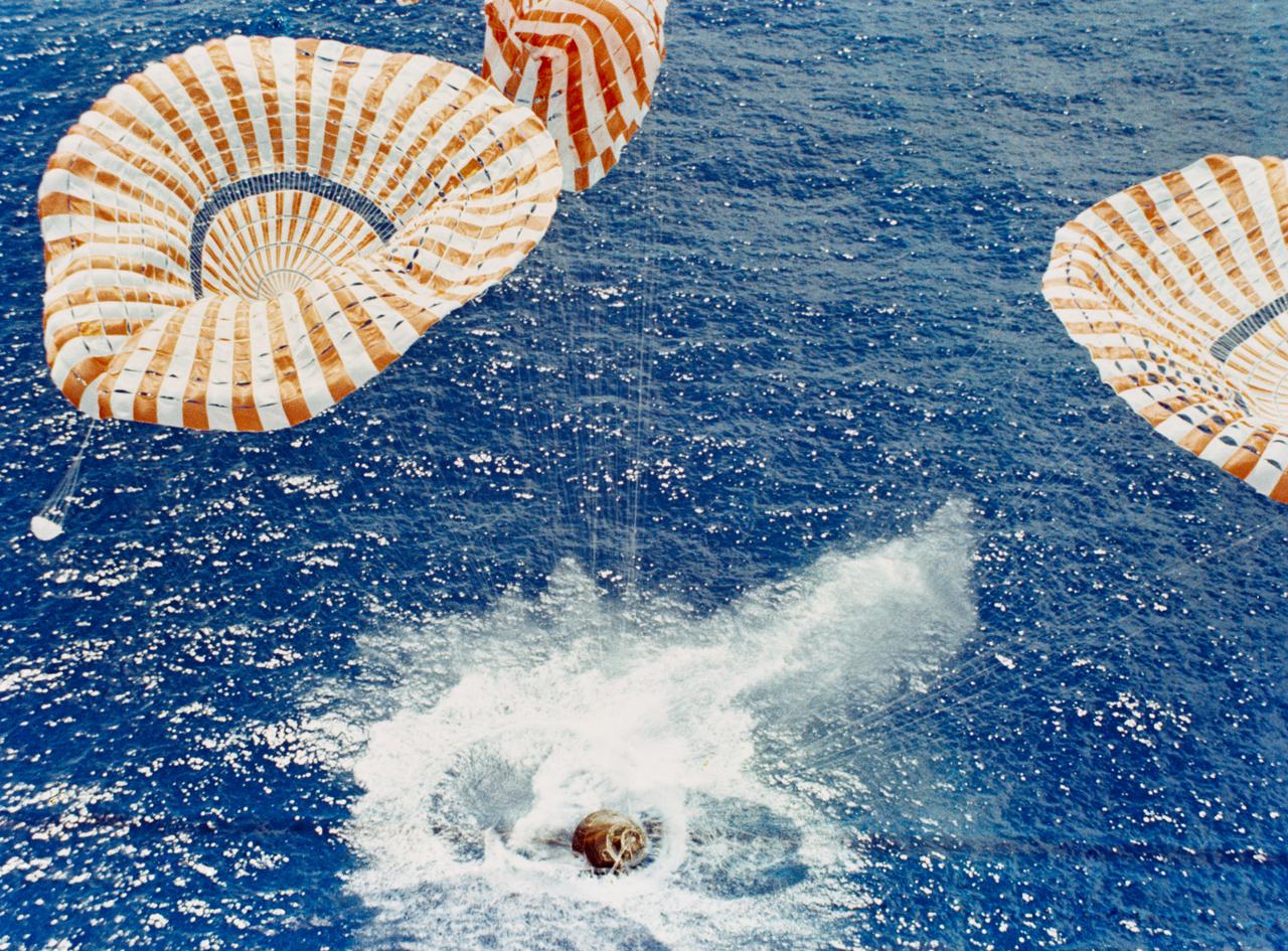 S71-43542 (7 Aug. 1971) --- The Apollo 15 Command Module (CM), with astronauts David R. Scott, commander; Alfred M. Worden, command module pilot; and James B. Irwin, lunar module pilot, aboard safely touches down in the mid-Pacific Ocean to conclude a highly successful lunar landing mission. Although causing no harm to the crew men, one of the three main parachutes failed to function properly. The splashdown occurred at 3:45:53 p.m. (CDT), Aug. 7, 1971, some 330 miles north of Honolulu, Hawaii. The three astronauts were picked up by helicopter and flown to the prime recovery ship, USS Okinawa, which was only 6 1/2 miles away.