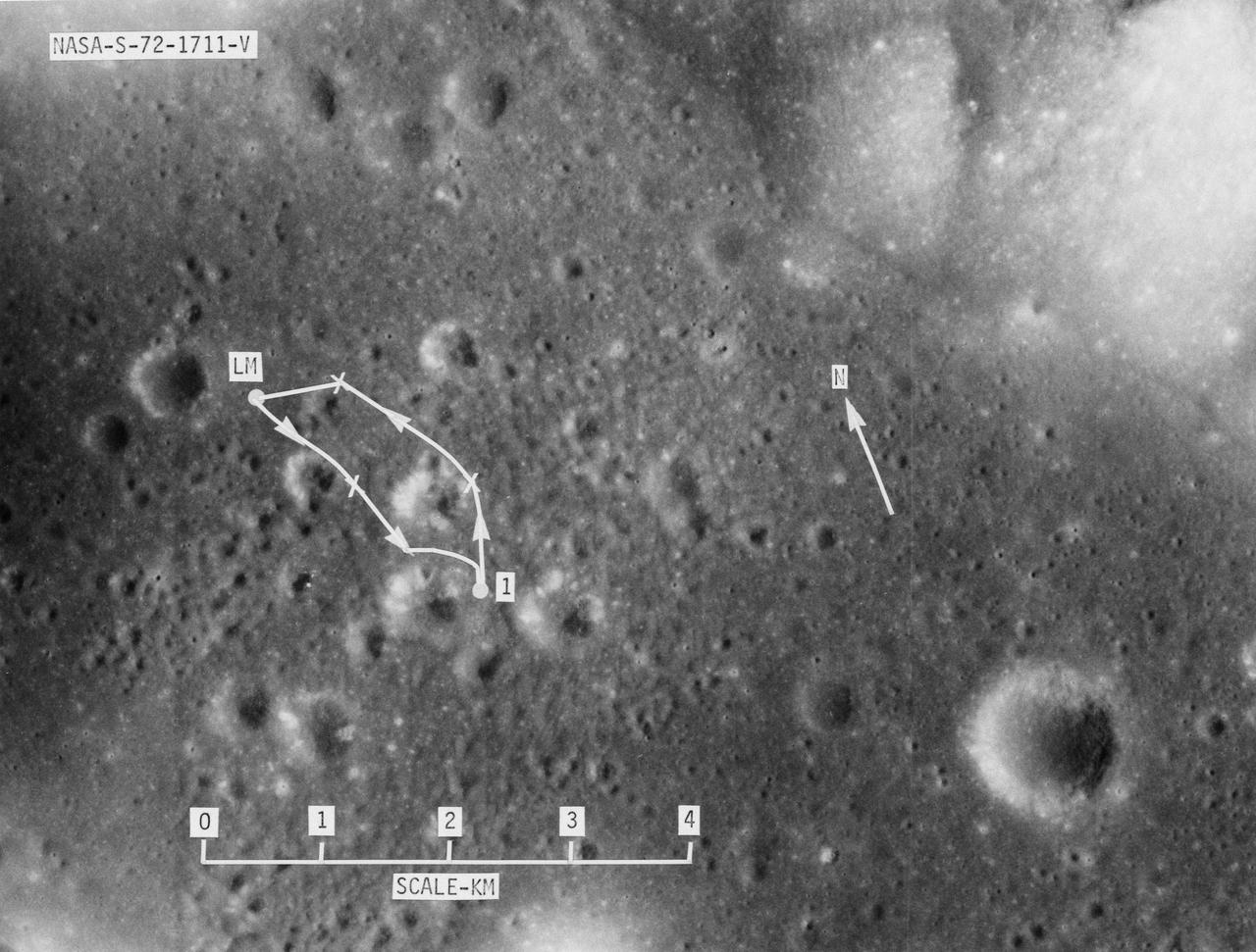 S72-01711 (July 1972) --- A vertical view of the Apollo 17 landing site in the Taurus-Littrow area of the lunar nearside, with an overlay showing the Lunar Roving Vehicle traverse proposed for the first extravehicular activity. The scale at the bottom is measured in kilometers. One kilometer equals 0.6214 statute mile. The coordinates of the Apollo 17 touchdown point are 30 degrees 44 minutes 58 seconds east longitude and 20 degrees 9 minutes 50 seconds north latitude. This photograph was taken from lunar orbit on an earlier Apollo mission.