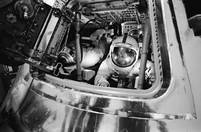 NASA image: Apollo 16 astronauts in Apollo Command Module Mission Simulator
