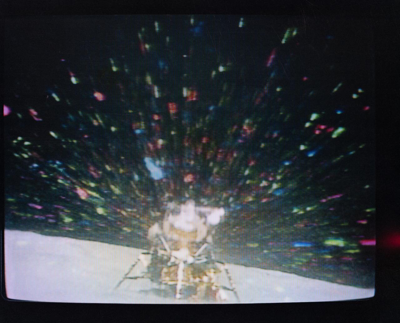 S72-35613 (22 April 1972) --- The Apollo 16 Lunar Module (LM) "Orion" in early lunar liftoff phase is featured in this lunar scene at the Descartes landing site. The still picture is a reproduction taken from a color television transmission made by a TV camera mounted on the Lunar Roving Vehicle (LRV). While astronauts John W. Young, commander; and Charles M. Duke Jr., lunar module pilot; descended in the Apollo 16 LM to explore the Descartes highlands landing site on the moon, astronaut Thomas K. Mattingly II, command module pilot, remained with the Command and Service Modules (CSM) "Casper" in lunar orbit.