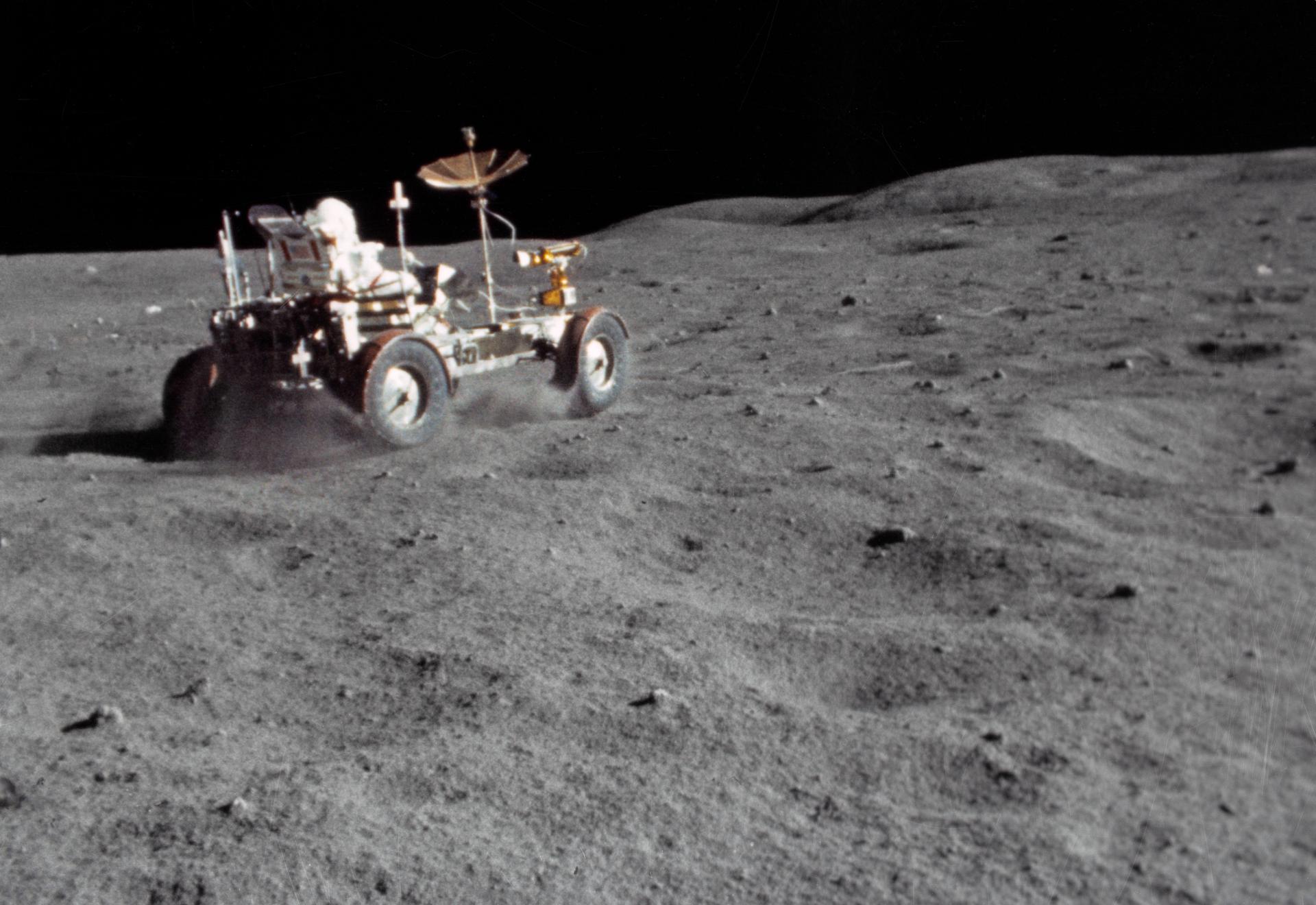 The Lunar Roving Vehicle (LRV) gets a high-speed workout by astronaut John W. Young in the "Grand Prix" run during the third Apollo 16 extravehicular activity at the Descartes landing site. This view is a frame from motion picture film exposed by a 16mm Maurer camera held by astronaut Charles M. Duke, Jr.