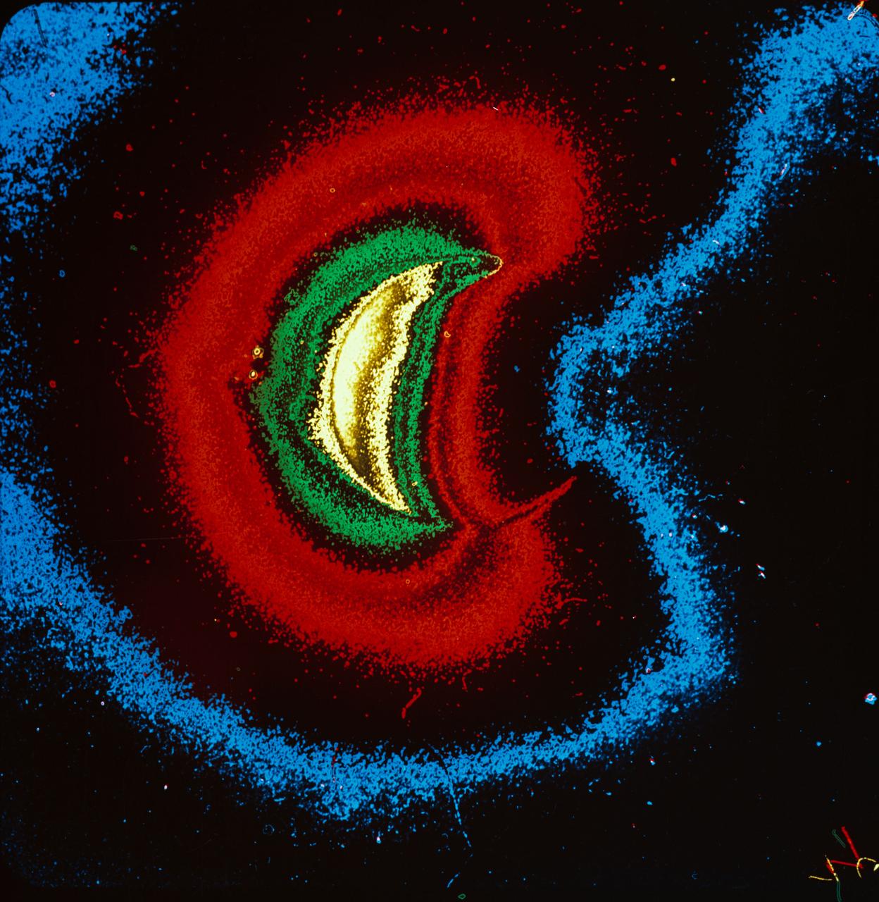 S72-40818 (21 April 1972) --- A color enhancement of an ultra-violet photograph of the geocorona, a halo of low density hydrogen around Earth. Sunlight is shining from the left, and the geocorona is brighter on that side. The UV camera was operated by astronaut John W. Young on the Apollo 16 lunar landing mission. It was designed and built at the Naval Research Laboratory, Washington, D.C. While astronauts Young, commander, and Charles M. Duke Jr., lunar module pilot, descended in the Lunar Module (LM) "Orion" to explore the Descartes highlands region of the moon, astronaut Thomas K. Mattingly II, command module pilot, remained with the Command and Service Modules (CSM) "Casper" in lunar orbit.