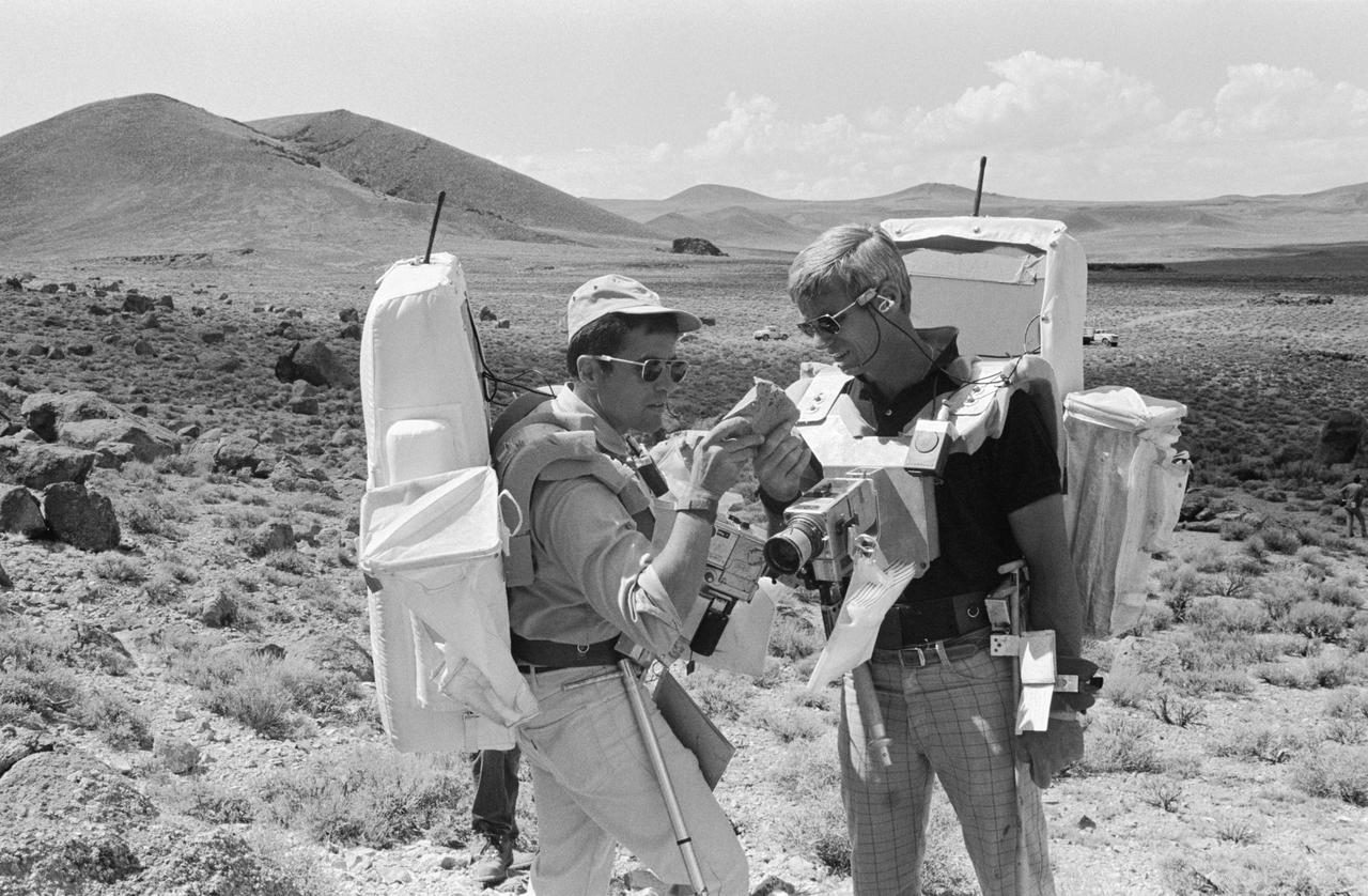 S72-48859 (6 Sept. 1972) --- Two members of the prime crew of the Apollo 17 lunar landing mission examine a rock specimen during lunar surface extravehicular activity simulation training on a geological field trip to the Pancake Range area of south-central Nevada. They are astronauts Eugene A. Cernan (right), commander; and Harrison H. Schmitt, lunar module pilot.