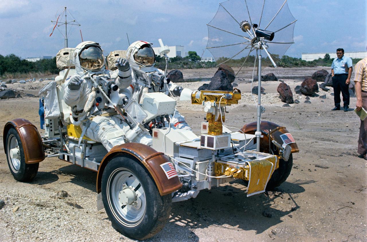 S72-48892 (September 1972) --- Two members of the prime crew of the Apollo 17 lunar landing mission ride in a Lunar Roving Vehicle trainer during lunar surface extravehicular activity simulation training at the Kennedy Space Center (KSC), Florida. Astronaut Eugene A. Cernan, commander, is seated in the left-hand seat. Scientist-astronaut Harrison H. Schmitt, lunar module pilot, is on Cernan's right.