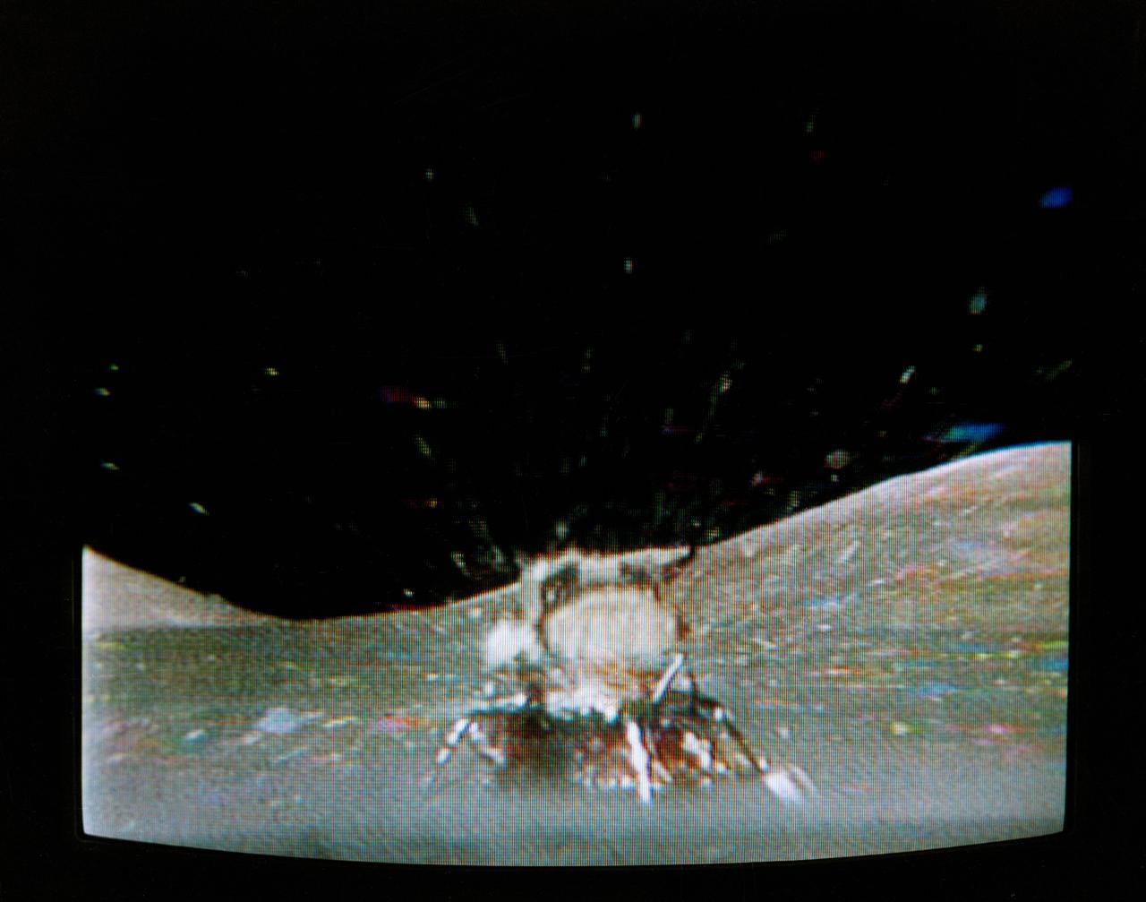 The Apollo 17 Lunar Module (LM) "Challenger" ascent stage leaves the Taurus-Littrow landing site as it makes its spectacular liftoff from the lunar surface, as seen in this reproduction taken from a color television transmission made by the color RCA TV camera mounted on the Lunar Roving Vehicle (LRV). The LRV-mounted TV camera, remotely controlled from the Mission Control Center (MCC) in Houston, made it possible for people on Earth to watch the fantastic event. The LM liftoff was at 188:01:36 ground elapsed time, 4:54:36 p.m. (CST), Thursday, December 14, 1972.