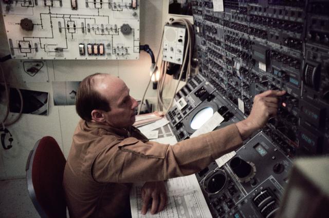 NASA image: Astronaut Charles Conrad Jr. working with control panel in Skylab simulation