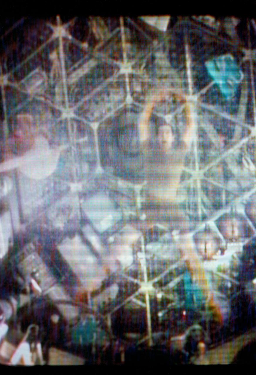 S73-27729 (1 June 1973) --- Scientist-astronaut Joseph P. Kerwin, Skylab 2 science pilot, floats with his body outstretched as he demonstrates weightlessness in the forward compartment of the Orbital Workshop of the Skylab 1 & 2 space station cluster in Earth orbit, as seen in this reproduction taken from a color television transmission made by a TV camera aboard the space station. Astronaut Charles Conrad Jr., Skylab 2 commander, is visible on Kerwin's right. The Skylab 2 crewmen performed exercises while floating. Photo credit: NASA