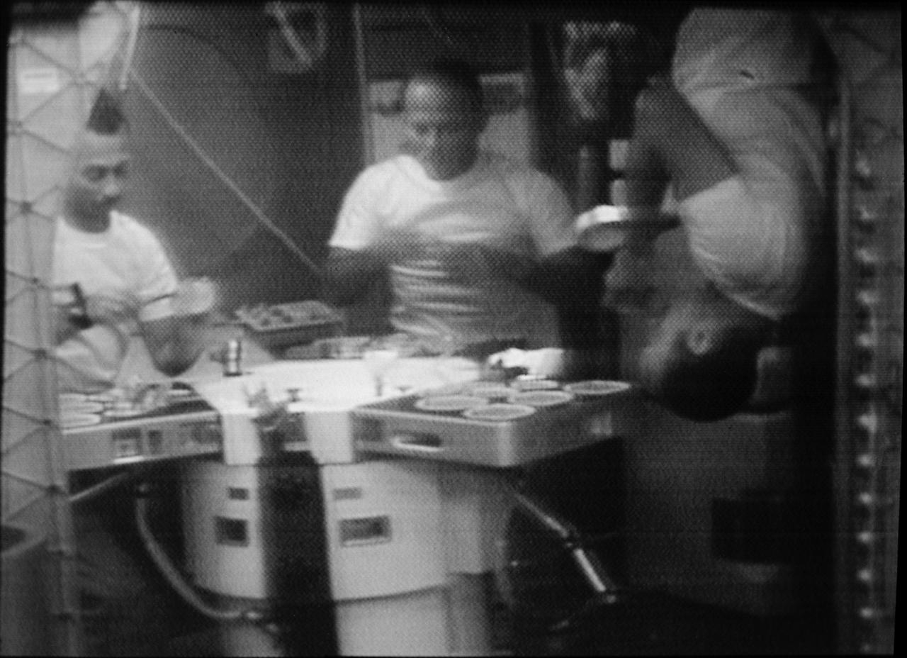 S73-31705 (1 Aug. 1973) --- The three Skylab 3 crewmen are shown eating in the Orbital Workshop (OWS) wardroom of the Skylab space station in Earth orbit, in this photographic reproduction taken from a television transmission made by a color TV camera aboard the OWS. Astronaut Alan L. Bean (right), commander, illustrates eating under zero-gravity conditions upsidedown. The two other crewmen are scientist-astronaut Owen K. Garriott (left), science pilot; and astronaut Jack R. Lousma, pilot. Photo credit: NASA