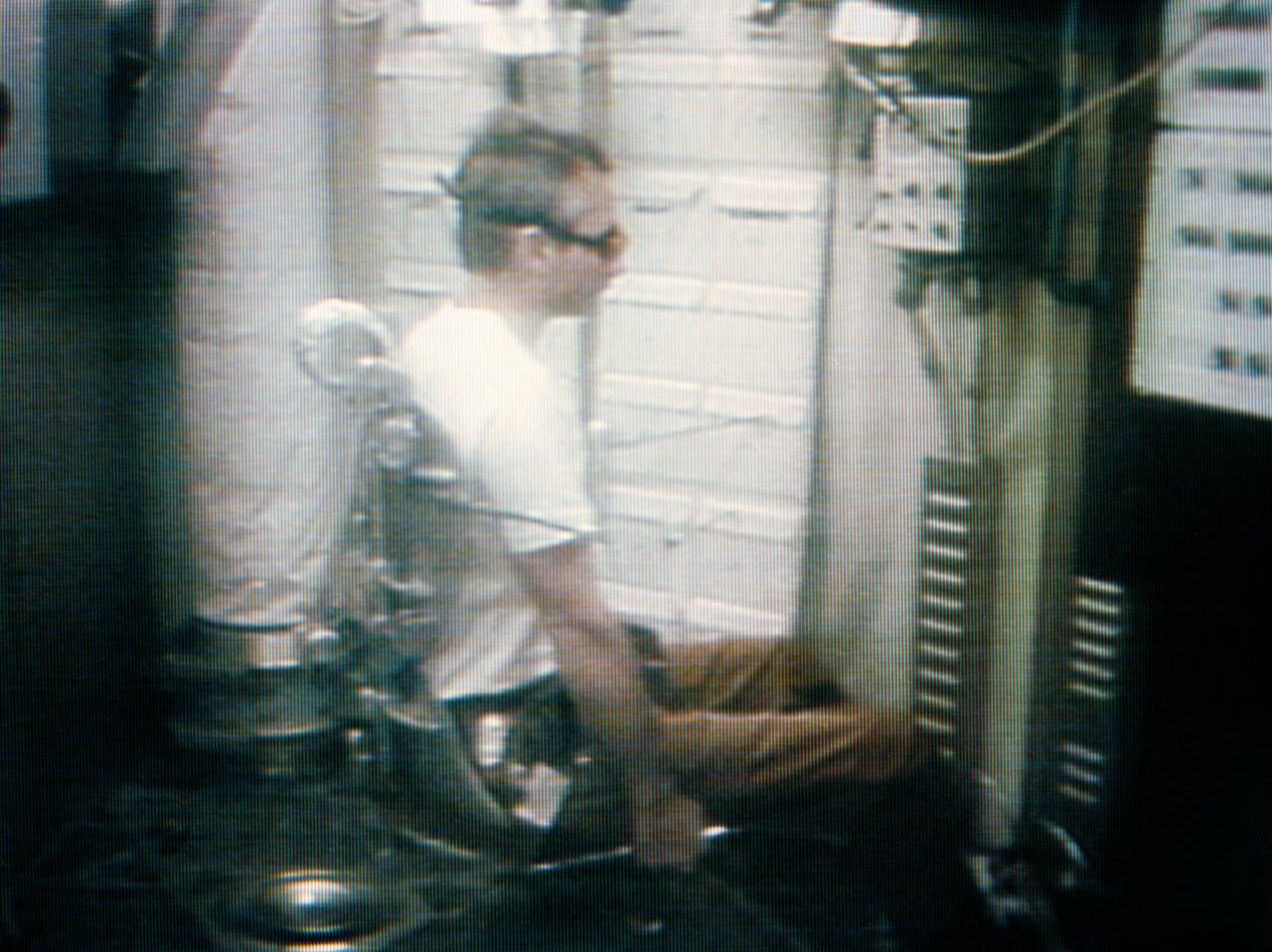 S73-34171 (9 Aug. 1973) --- Scientist-astronaut Owen K. Garriott, Skylab 3 science pilot, serves as test subject for the Skylab ?Human Vestibular Function? M131 Experiment, as seen in this photographic reproduction taken from a television transmission made by a color TV camera aboard the Skylab space station in Earth orbit. The objectives of the Skylab M131 experiment are to obtain data pertinent to establishing the validity of measurements of specific behavioral/physiological responses influenced by vestibular activity under one-g and zero-g conditions; to determine man?s adaptability to unusual vestibular conditions and predict habitability of future spacecraft conditions involving reduced gravity and Coriollis forces; and to measure the accuracy and variability in man?s judgment of spatial coordinates based on atypical gravity receptor cues and inadequate visual cures. Dr. Garriott is seated in the experiment?s litter chair which can rotate the test subject at predetermined rotational velocity or programmed acceleration/decelerational profile. Photo credit: NASA