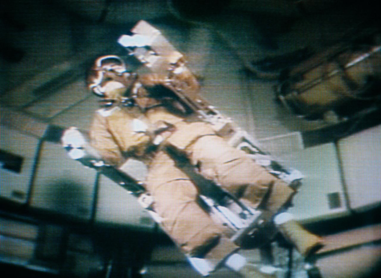 S73-34207 (28 Aug. 1973) --- Astronaut Alan L. Bean, Skylab 3 commander, flies the M509 astronaut Maneuvering Equipment, as seen in this photographic reproduction taken from a television transmission made by a color television camera in the Orbital Workshop (OWS) of the Skylab space station in Earth orbit. Bean is strapped into the back-mounted, hand-controlled Automatically Stabilized Maneuvering Unit (ASMU). The M509 exercise was in the forward dome area of the OWS. The dome area is about 22 feet in diameter and 19 feet from top to bottom. Photo credit: NASA