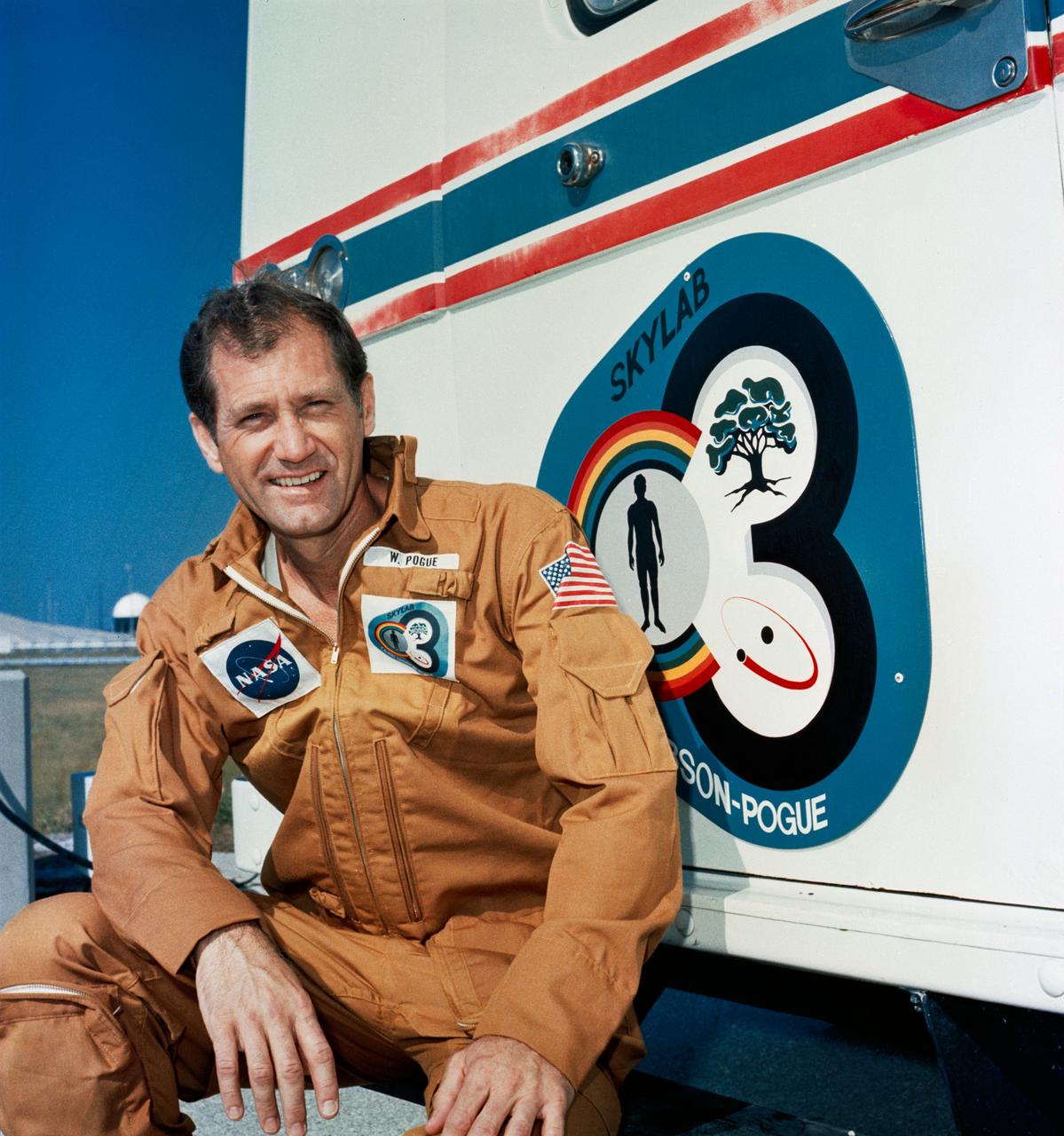 S73-36901 (8 Nov. 1973) --- Astronaut William R. Pogue, pilot of the Skylab 4 mission, relaxes on the running board of the transfer van during a visit to the Skylab 4/Saturn 1B space vehicle at Pad B, Launch Complex 39, Kennedy Space Center, Florida. On the morning of the launch the transfer van will transport astronauts Pogue, Gerald P. Carr, commander; and Edward G. Gibson, science pilot, from the suiting building to Pad B. Skylab 4, the third and last visit to the Skylab space station in Earth orbit, will return additional information on the Earth and sun, as well as provide a favorable location from which to observe the recently discovered Comet Kohoutek. Photo credit: NASA