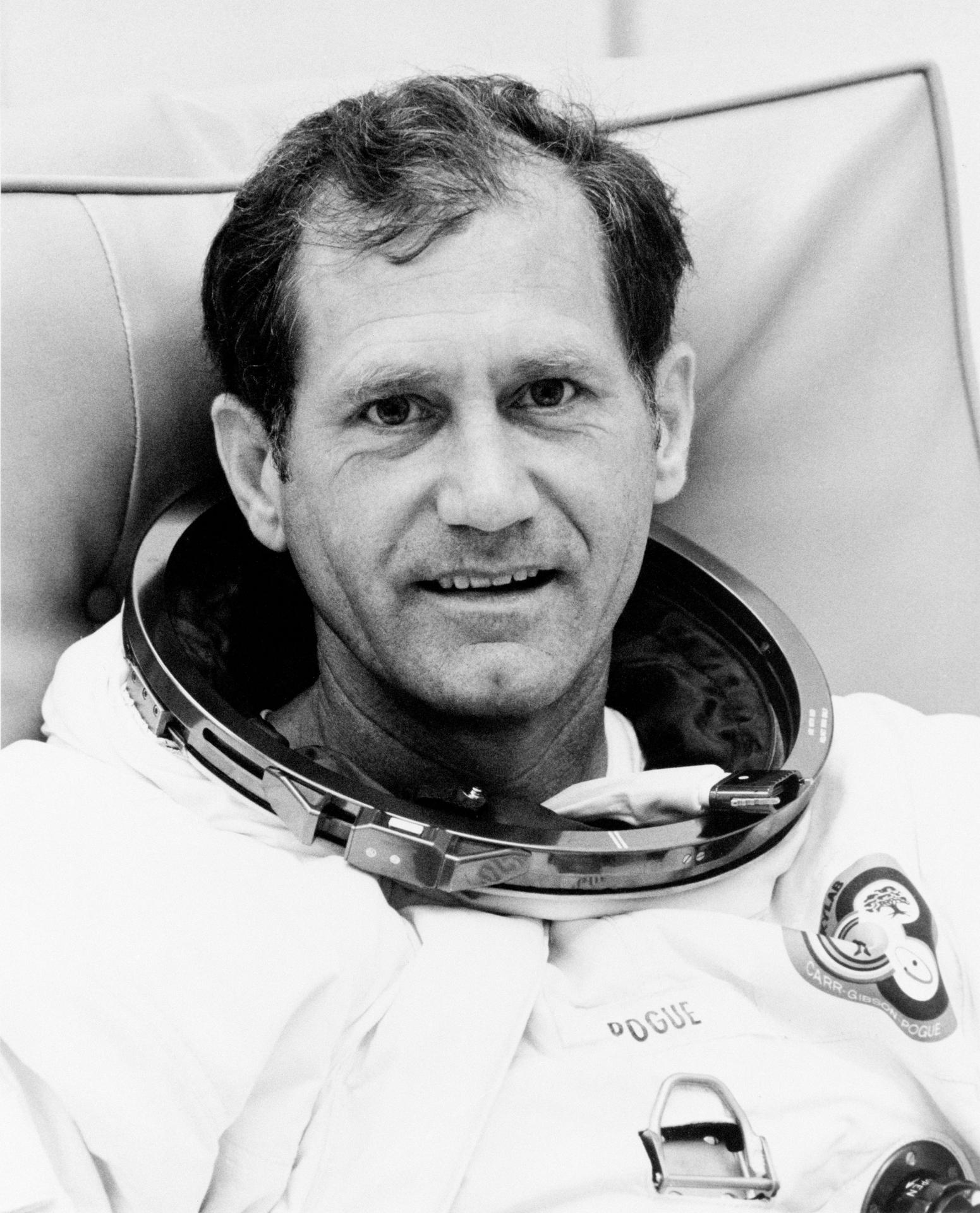 Astronaut Bill Pogue relaxes in his space suit at Kennedy Space Center a few days before his launch.