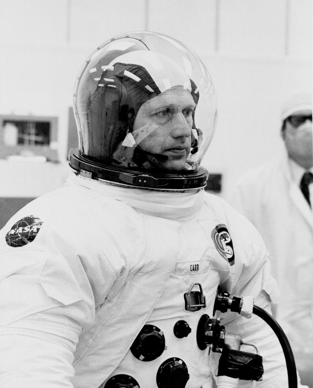 S73-36908 (8 Nov. 1973) --- Astronaut Gerald P. Carr, commander of the Skylab 4 mission, undergoes spacesuit pressure and fit checks at the Kennedy Space Center, Florida. This shoulder and head shot of Carr was taken a few days before the scheduled Skylab 4 launch. This third and last visit to the Skylab space station in Earth orbit will return additional information on the Earth and sun, as well as provide a favorable location from which to observe the recently discovered Comet Kohoutek. The other two members of the Skylab 4 crew will be astronaut William R. Pogue, pilot; and scientist-astronaut Edward G. Gibson, science pilot. Photo credit: NASA