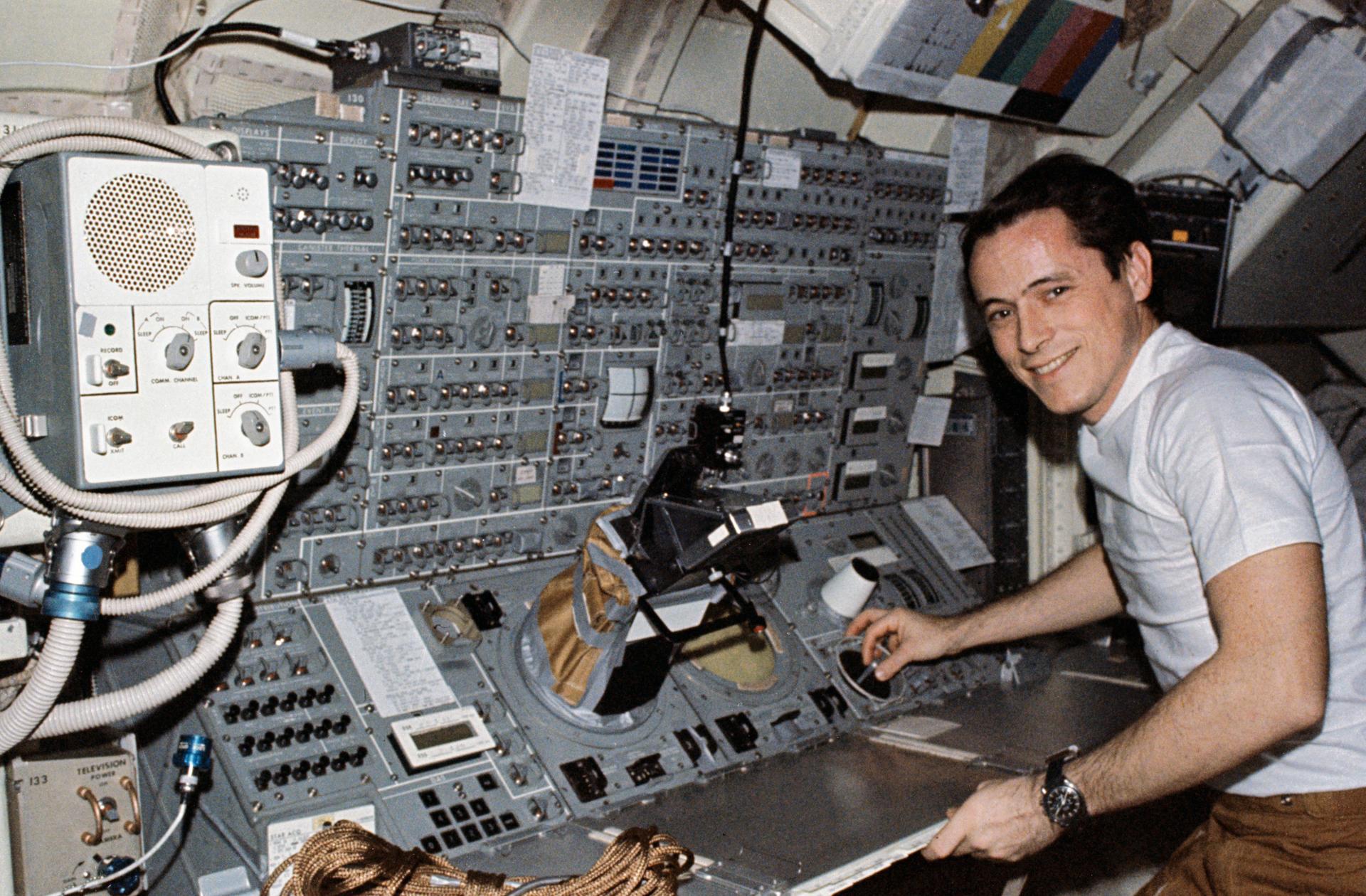 Scientist-astronaut Edward G. Gibson stands at the Apollo Telescope Mount (ATM) console.