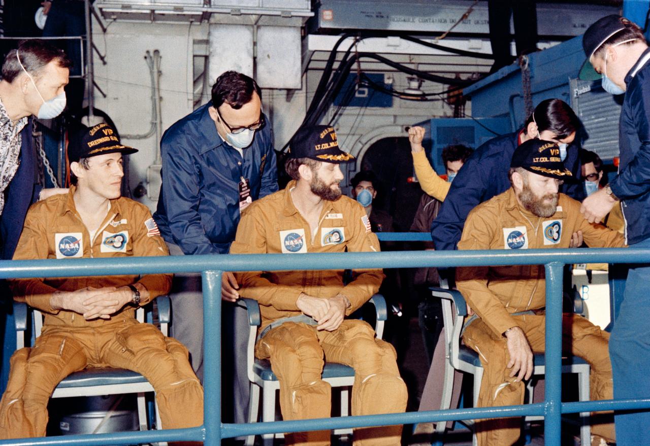 S74-17744 (8 Feb. 1974) --- The crewmen of the third and final manned Skylab mission relax on the USS New Orleans, prime recovery ship for their mission, about an hour after their Command Module splashed down at 10:17 a.m. (CDT), Feb. 8, 1974. The splashdown, which occurred 176 statute miles from San Diego, ended 84 record-setting days of flight activity aboard the Skylab space station cluster in Earth orbit. Photo credit: NASA