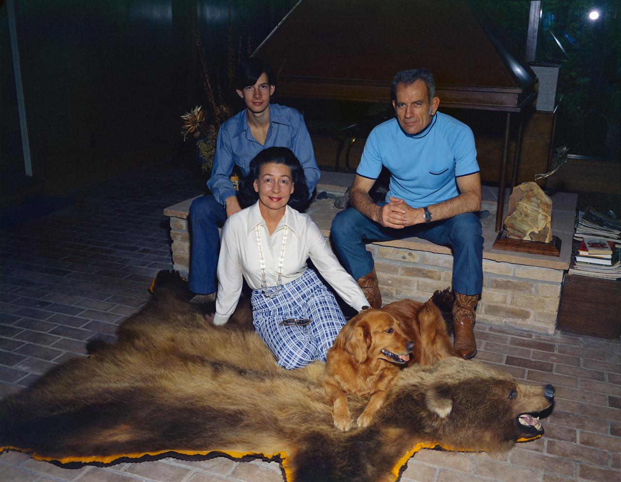 S74-19497 (January 1974) --- Astronaut Donald K. Slayton is shown with his wife, Marjorie, and their son, Kent, 17, at their home in Friendswood, Texas. Slayton is the Director of Flight Crew Operations at NASA's Johnson Space Center. He will be the Docking Module Pilot of the American Crew of the Joint U.S.-USSR Apollo-Soyuz Test Project (ASTP) mission. This portrait includes one of the family pets.
