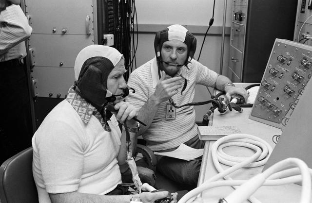 NASA image: Cosmonaut Aleksey Leonov briefed on Apollo Communications test system console