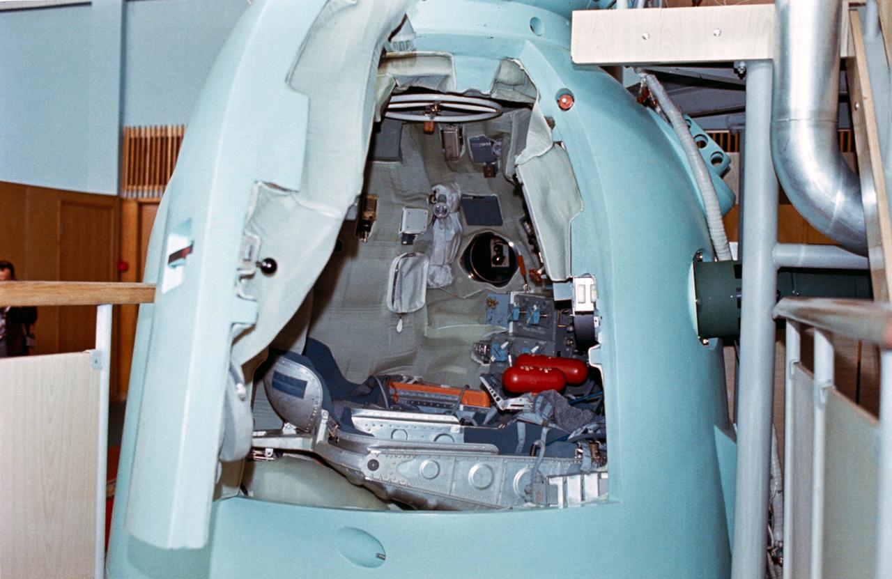 S74-24677 (June 1974) --- A close-up view of the descent vehicle of the Soyuz spacecraft training mock-up on display at the Cosmonuat Training Center (Star City) near Moscow. The open hatch reveals the interior arrangement of the middle section of the Soviet spacecraft. The first (fore) section of the Soyuz is called the orbital module; and the third (aft) section is the instrument-assembly module. The joint U.S.-USSR Apollo-Soyuz docking mission in Earth orbit is scheduled for the summer of 1975.