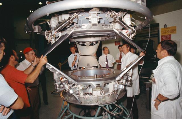NASA image: American & Soviet engineers examine ASTP docking set-up following tests
