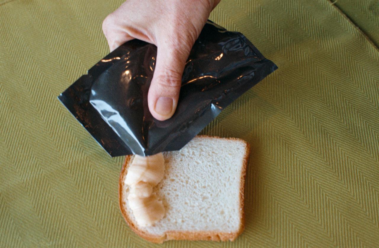 S74-25635 (August 1974) --- A close-up view of cheddar cheese spread, one of the items of food selected for the Apollo-Soyuz Test Project mission scheduled for the summer of 1975. This food item was carried on the Apollo missions also.