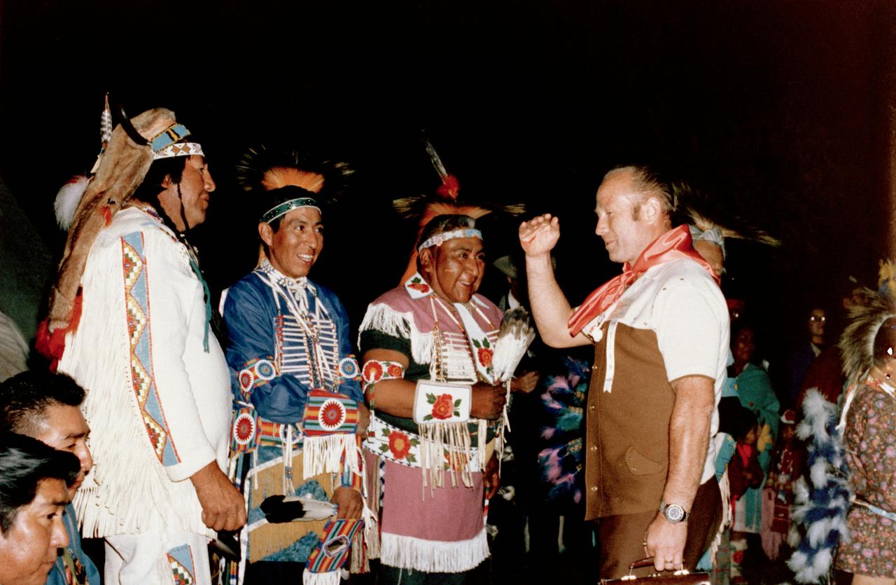 S75-20108 (September 1974) --- Cosmonaut Aleksey A. Leonov (right), commander of the first (prime) crew of Soviet cosmonauts on the planned Apollo-Soyuz Test Project (ASTP), enjoys a tribal welcome from Shoshone Indians during a hunting trip in the Lander, Wyoming area. Leonov was in the United States to take part in joint crew training at the Johnson Space Center.