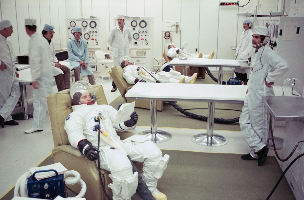 S75-21063 (January 1975) --- The three members of the American ASTP backup crew are suited up for the testing of the Apollo spacecraft at the Kennedy Space Center. They are (from foreground) astronauts Alan L. Bean, commander; Ronald E. Evans, command module pilot; and Jack R. Lousma, docking module pilot. Later, they entered the Apollo Command Module in an altitude chamber for tests of spacecraft systems. The testing was in preparation for the joint U.S.?USSR Apollo-Soyuz Test Project docking mission in Earth orbit scheduled for July 1975.