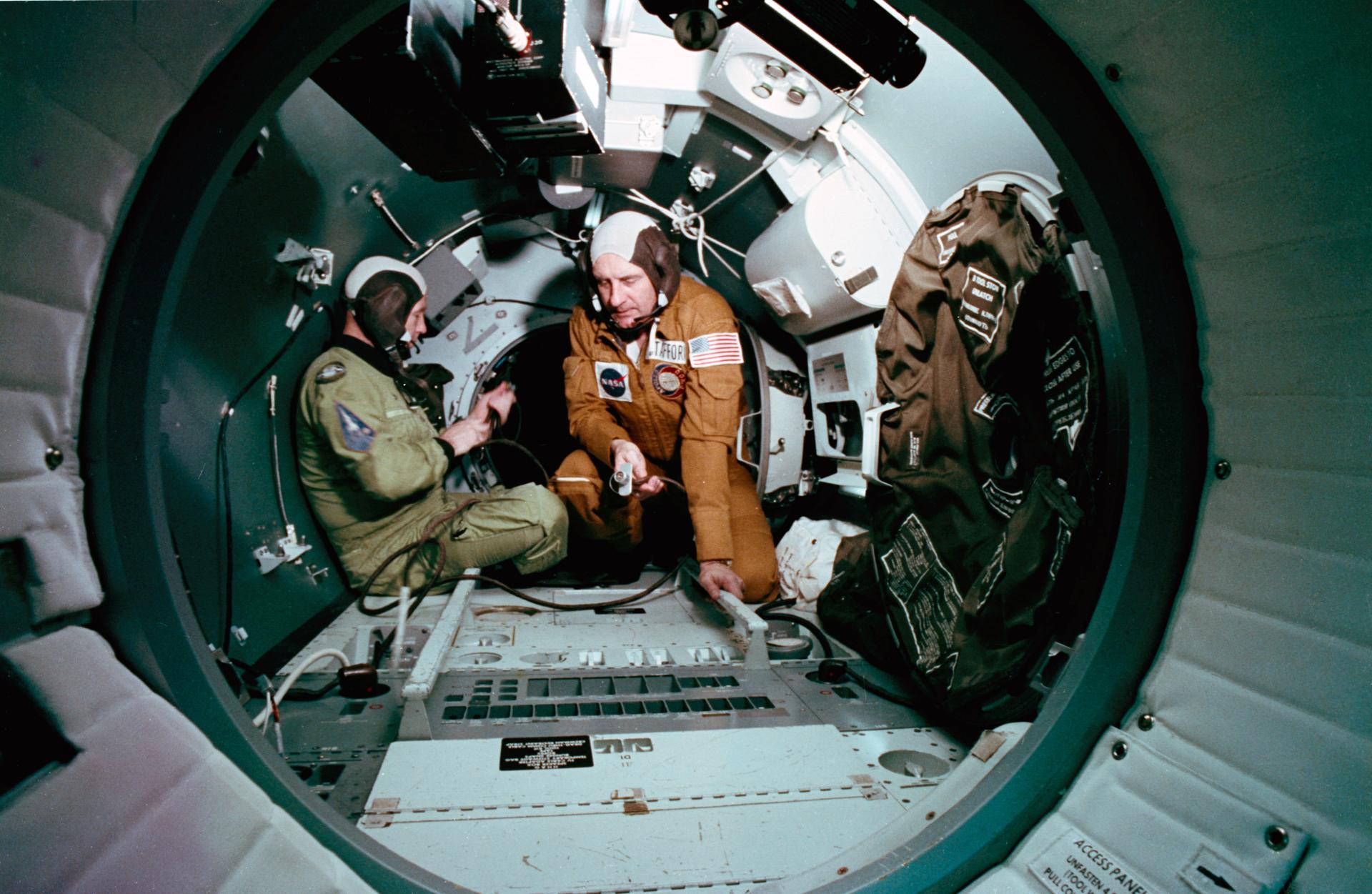 An interior view of the Docking Module trainer during Apollo-Soyuz Test Project (ASTP) joint crew training