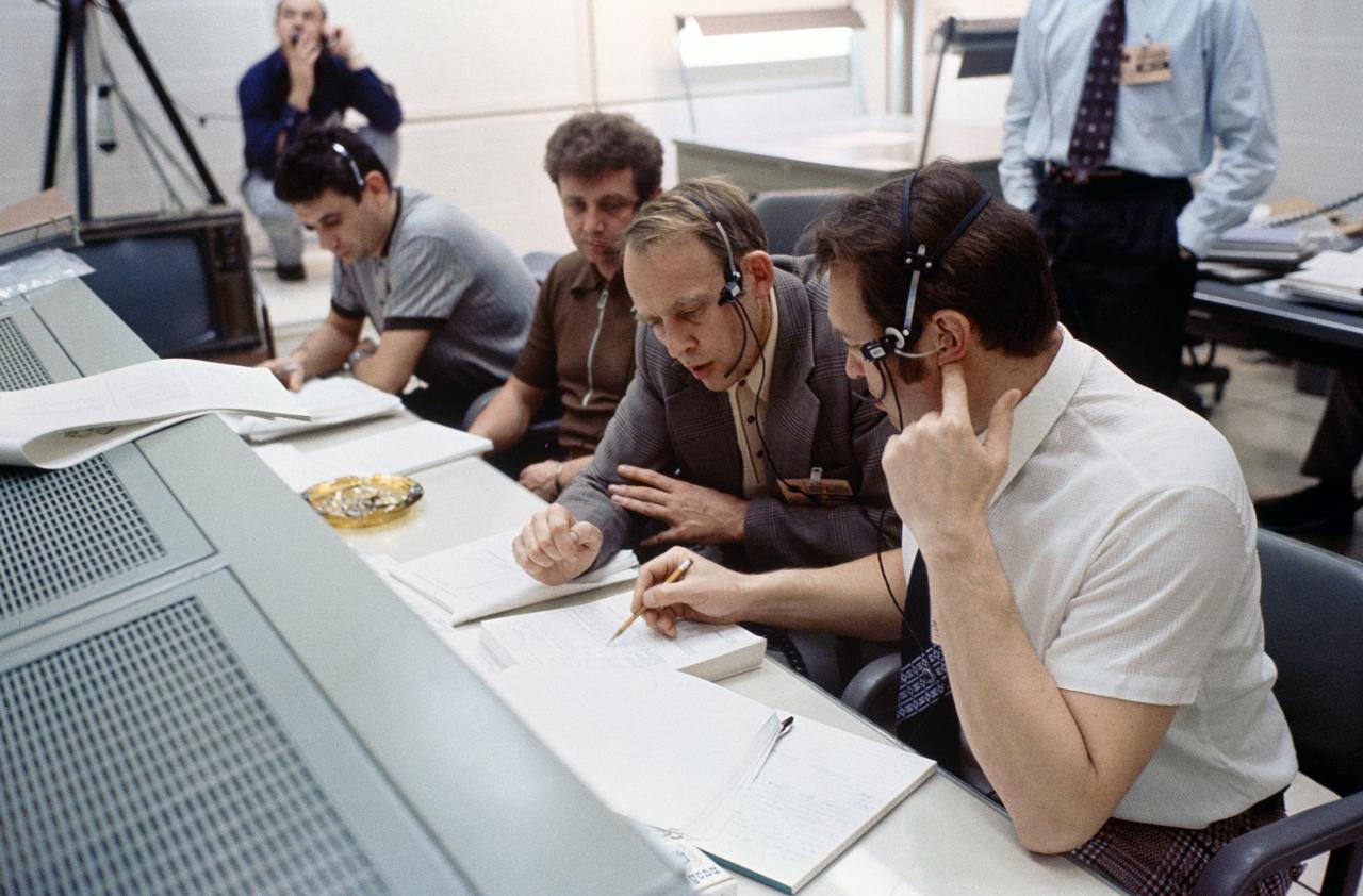 S75-23881 (20 March 1975) --- A group of flight controllers from the Soviet Union take part in ASTP joint simulation activity at NASA's Johnson Space Center. They are in one of the support rooms in the Mission Control Center. The simulations are part of the preparations for the U.S.-USSR Apollo-Soyuz Test Project docking mission in Earth orbit scheduled for July 1975.