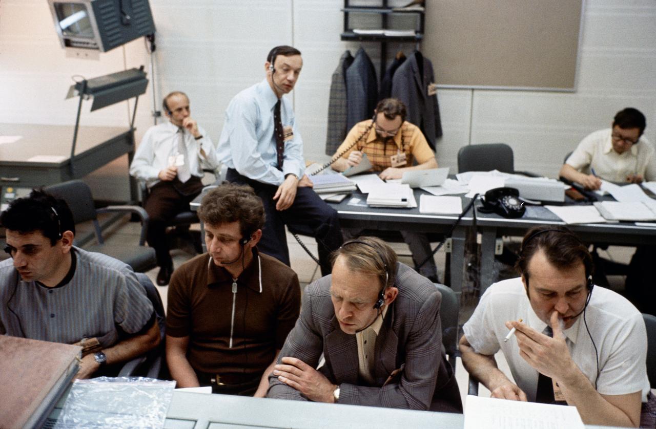 S75-23883 (20 March 1975) --- A group of flight controllers from the Soviet Union take part in ASTP joint simulation activity at NASA's Johnson Space Center. They are in one of the support rooms in the Mission Control Center. The simulations are part of the preparations for the U.S.-USSR Apollo-Soyuz Test Project docking mission in Earth orbit scheduled for July 1975.
