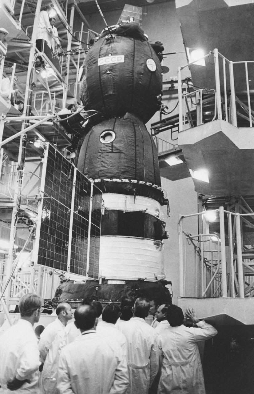 S75-25615 (April 1975) --- The Soviet Soyuz spacecraft for the Apollo-Soyuz Test Project mission is seen during prelaunch preparations at the Baikonur launch complex near Tyuratam in the Kazakh Soviet Socialist Republic.  American ASTP crewmen visited the site while in the Soviet Union for training at the Cosmonaut Training Center (Star City) near Moscow. The Baikonur launch facility is located some 2,100 kilometers (1,300 miles) southeast of Moscow. The three major components of the Soyuz spacecraft are the Orbital Module (top), Descent Vehicle (in middle) and the Instrument Assemble Module (at bottom with solar panels). PHOTO COURTESY:  USSR ACADEMY OF SCIENCES