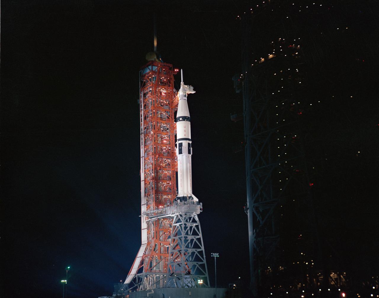 S75-28387 (2 July 1975) --- A nighttime view of Pad B, Launch Complex 39, Kennedy Space Center, showing the ASTP Apollo/Saturn 1B space vehicle on the pad during Apollo-Soyuz Test Project prelaunch preparations. An ASTP countdown demonstration ?wet? test (CDDT) was being conducted at KSC when this photograph was taken. The liftoff was on July 15, 1975.