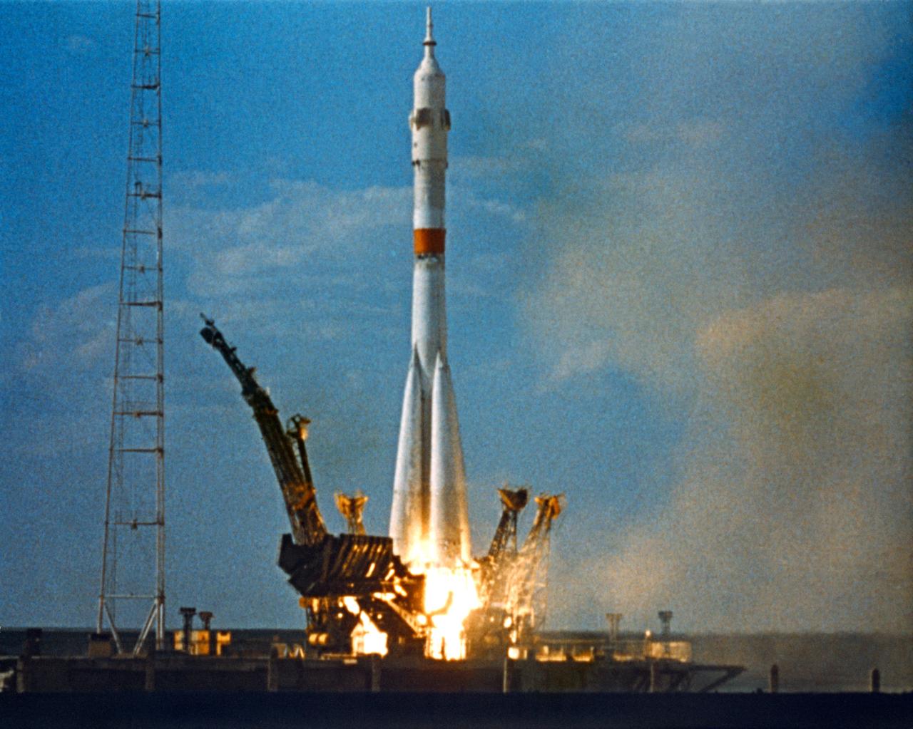 S75-33375 (15 July 1975) --- The Soviet Soyuz space vehicle, with cosmonauts Aleksey A. Leonov and Valeriy N. Kubasov aboard, is launched on the morning of July 15, 1975 from a pad at the Baikonur Cosmodrome in Kazahstan to begin the joint U.S.-USSR Apollo-Soyuz Test Project docking mission in Earth orbit. The Soyuz space vehicle is composed of the three-stage launch vehicle, the two-man, three-module Soyuz spacecraft and the launch escape system. The Soviet spacecraft (Soyuz 19) was launched seven and one-half hours before the American ASTP/Apollo-Saturn 1B liftoff from Kennedy Space Center (KSC), Florida. The American and Soviet spacecraft were joined together in space for approximately 47 hours on July 17-18-19, 1975.  This picture was reproduced from a frame of 35mm film furnished by the USSR in an exchange of photography taken during the mission. PHOTO COURTESY: USSR ACADEMY OF SCIENCES