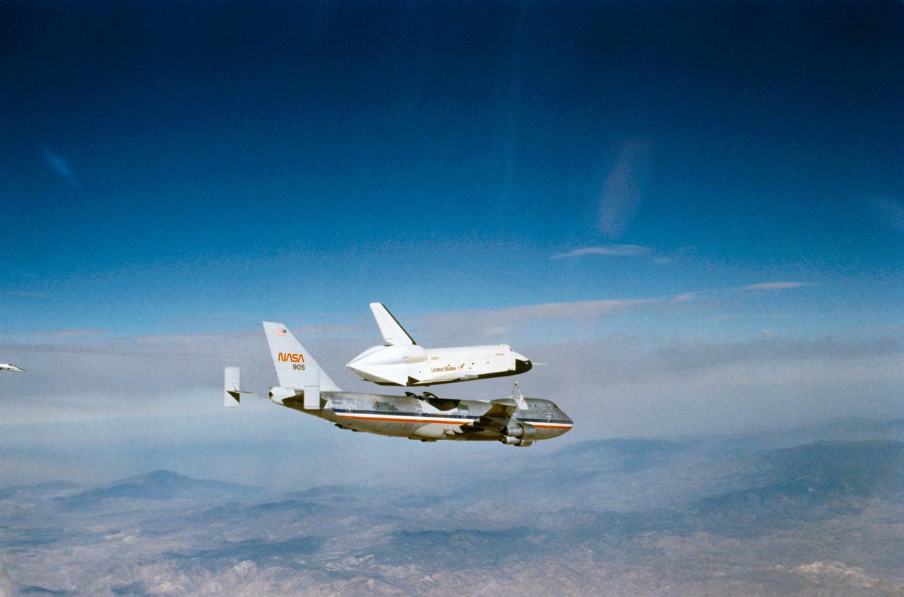 S77-28136 (13 Sept 1977) --- The Orbiter 101 "Enterprise" is seen separating from the NASA 747 carrier aircraft during the second free flight of the Shuttle Approach and Landing Tests (ALTs) conducted on September 13, 1977 at Dryden Flight Research Center in Southern California. Astronauts Joe H. Engle, and Richard H. Truly were the crew of the "Enterprise." The ALT free flights are designed to verify Orbiter subsonic airworthiness, integrated systems operations and pilot-guided approach and landing capability and satisfying prerequisites to automatic flight control and navigation mode.