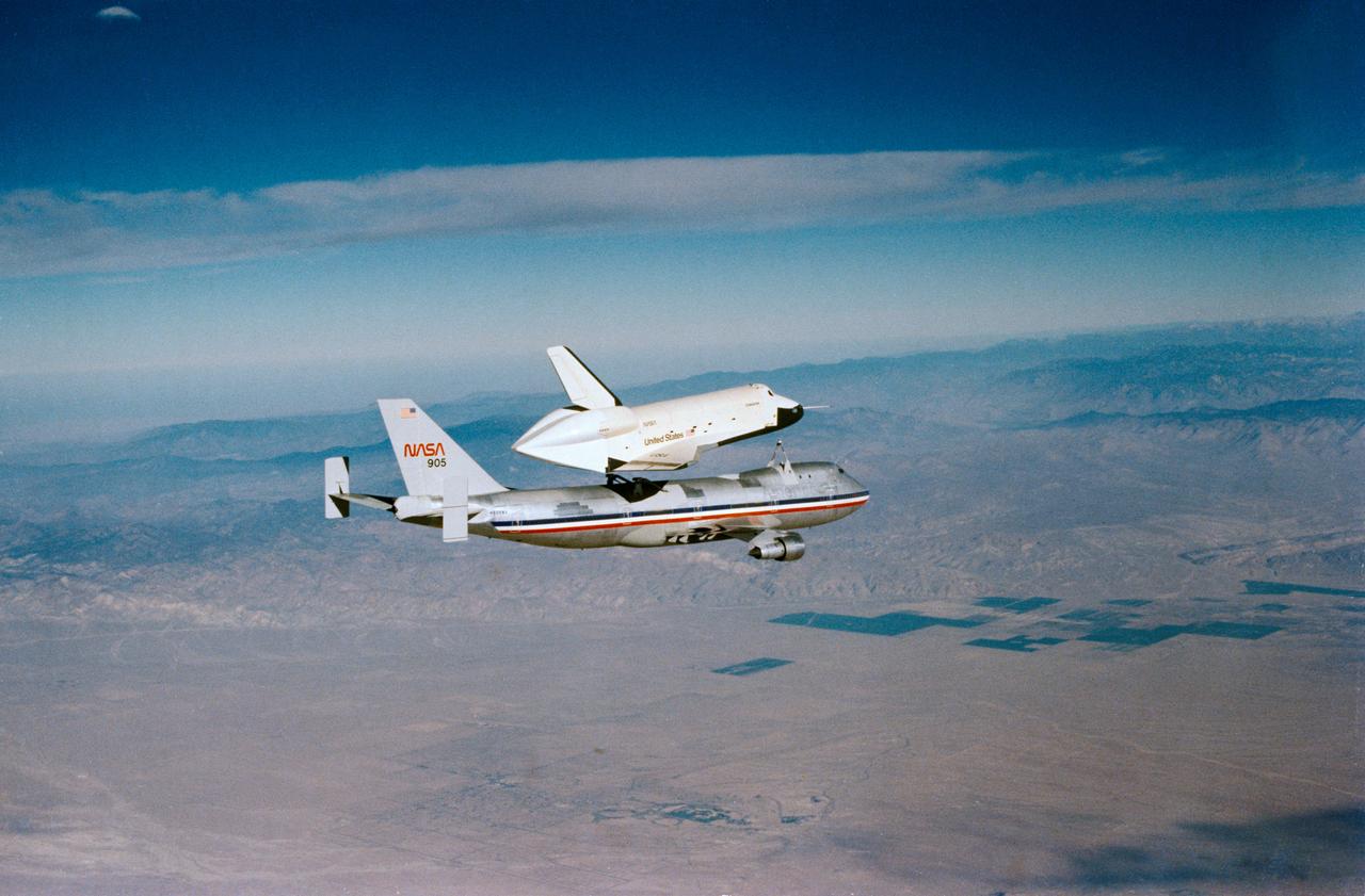 S77-28542 (23 Sept 1977) --- The shuttle Orbiter 101 "Enterprise" separates from the NASA 747 carrier aircraft during the third free flight of the Shuttle Approach and Landing Tests (ALT) conducted on September 23, 1977, at the Dryden Flight Research Center (DFRC) in Southern California. The vehicle, with astronauts Fred W. Haise Jr., commander, and C. Gordon Fullerton, pilot, remained in unpowered flight for five-minutes and 34-seconds before landing on the desert land of Edwards Air Force Base.