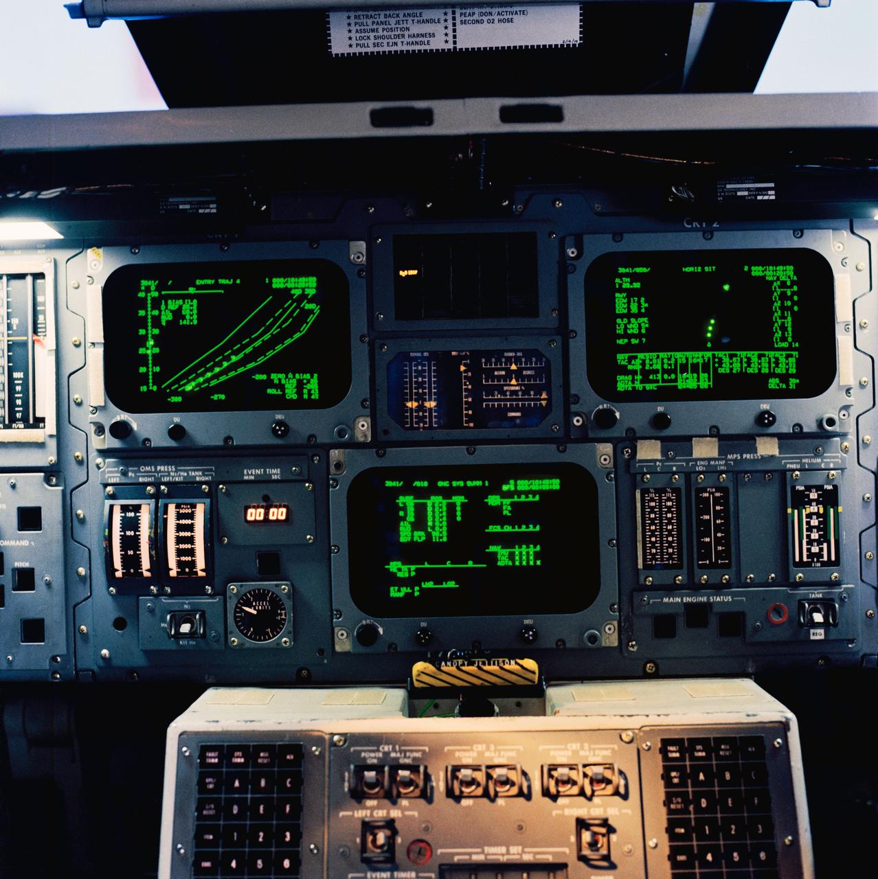 S79-29067 (15 March 1979) --- An interior view of the space shuttle mission simulator (SMS), featuring the area between the commander and pilot positions which houses displays and controls. The cathode ray tube (CRT) computer displays are at top; a portion of the computer keyboards for the commander and pilot can be seen at bottom center. This SMS motion base simulator is located in the mission simulation and training facility at NASA's Johnson Space Center (JSC). Photo credit: NASA