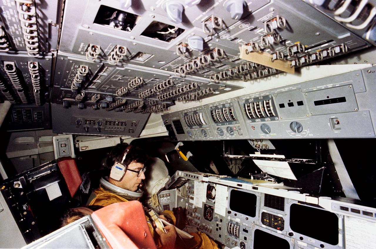 S79-37006 (29 Sept. 1979) --- Astronaut John W. Young, commander of STS-1, goes through a simulation exercises in the shuttle mission simulator (SMS) in the mission simulation and training facility at NASA's Johnson Space Center (JSC). Young and astronaut Robert L. Crippen, prime crew pilot, are in training for the first of series of orbital test missions aboard the Columbia. Photo credit: NASA