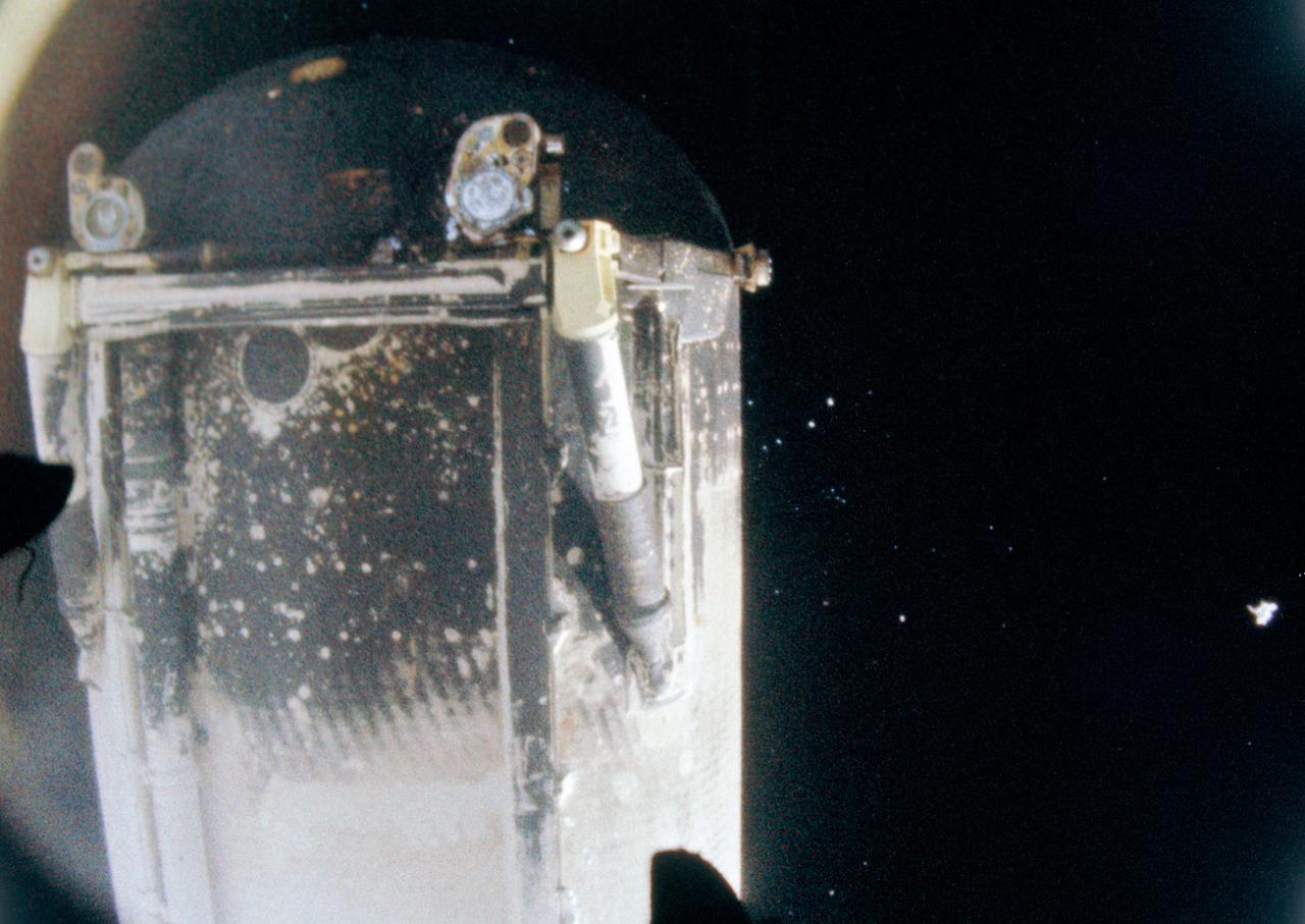 S81-30505 (12 April 1981) --- Separation of space shuttle Columbia?s external tank, photographed by motion picture cameras in the umbilical bays, occurred following the shutdown of the vehicle?s three main engines.  Columbia?s cameras were able to record the bottom side of the tank as the orbiter headed toward its Earth-orbital mission with astronauts John W. Young and Robert L. Crippen aboard and the fuel tank fell toward Earth, passing through the atmosphere rapidly.  Liquid oxygen and liquid hydrogen umbilical connectors can be seen at the bottom of the tank. For orientation, the photo should be held with the rounded end at bottom of the frame. Photo credit: NASA