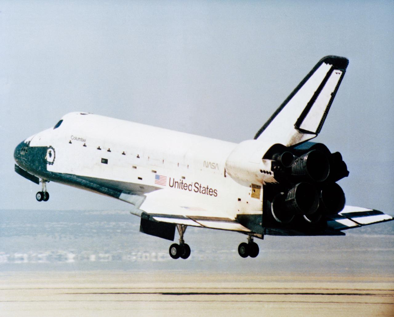 S81-30744 (14 April 1981) --- The rear wheels of the space shuttle orbiter Columbia are about to touch down on Rogers Lake (a dry bed) at Edwards Air Force Base in southern California to successfully complete a stay in space of more than two days. Astronauts John W. Young, STS-1 commander, and Robert L. Crippen, pilot, are aboard the vehicle. The mission marked the first NASA flight to end with a wheeled landing and represents the beginning of a new age of spaceflight that will employ the same hardware repeatedly. Photo credit: NASA
