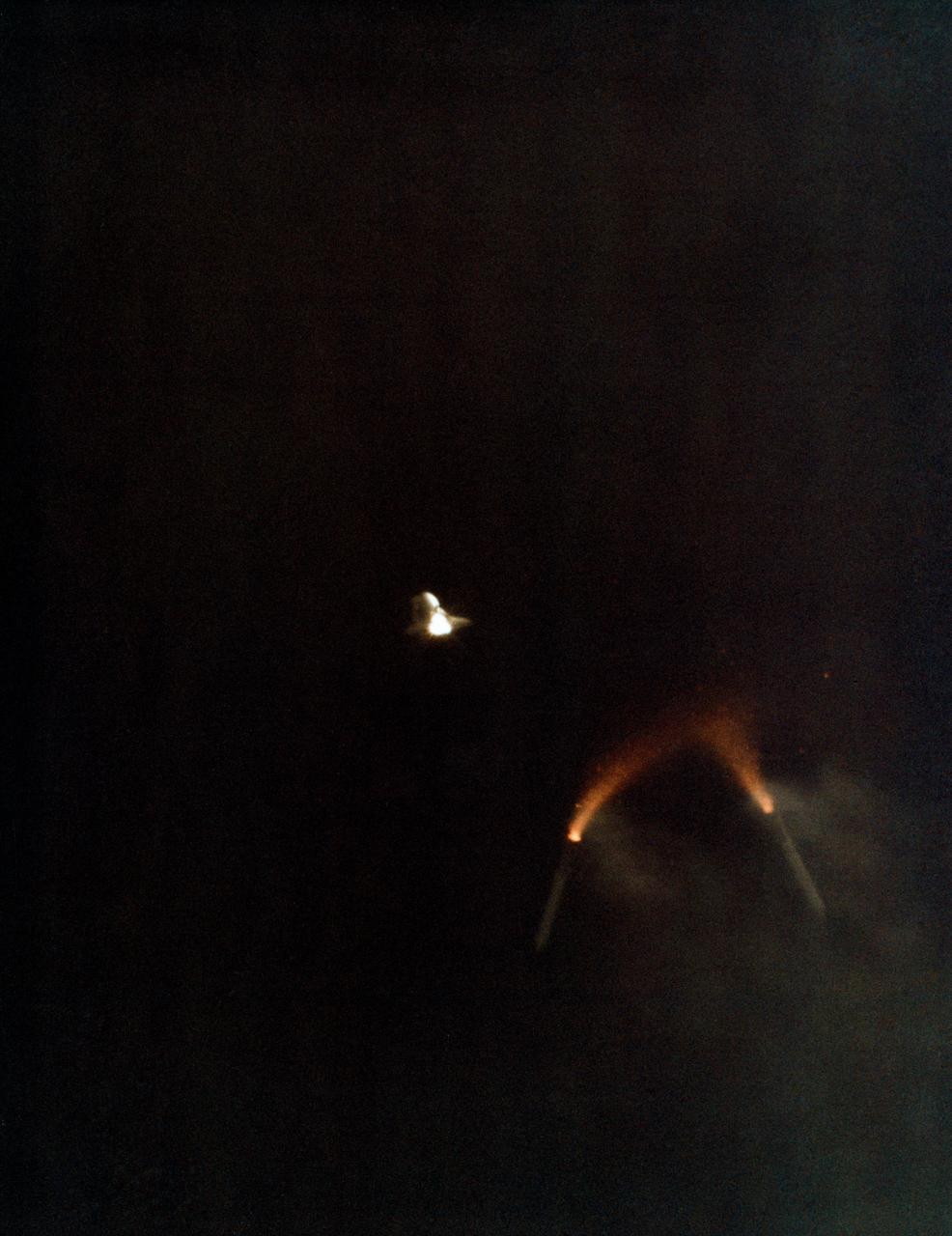 S81-33178 (12 April 1981) --- The two solid rocket boosters are jettisoned from the climbing space shuttle Columbia as a successful launch phase continues for NASA's first manned space mission since 1975. Astronauts John W. Young and Robert L. Crippen are aboard Columbia. Photo credit: NASA