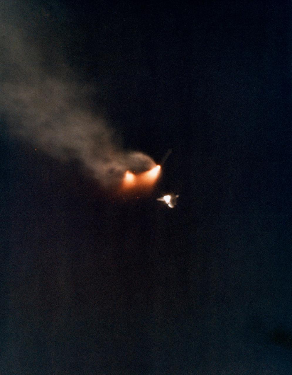 S81-33180 (12 April 1981) --- The two solid rocket boosters are jettisoned from the climbing space shuttle Columbia as a successful launch phase continues for NASA's first manned space mission since 1975. Astronauts John W. Young and Robert L. Crippen are aboard the Columbia. Photo credit: NASA