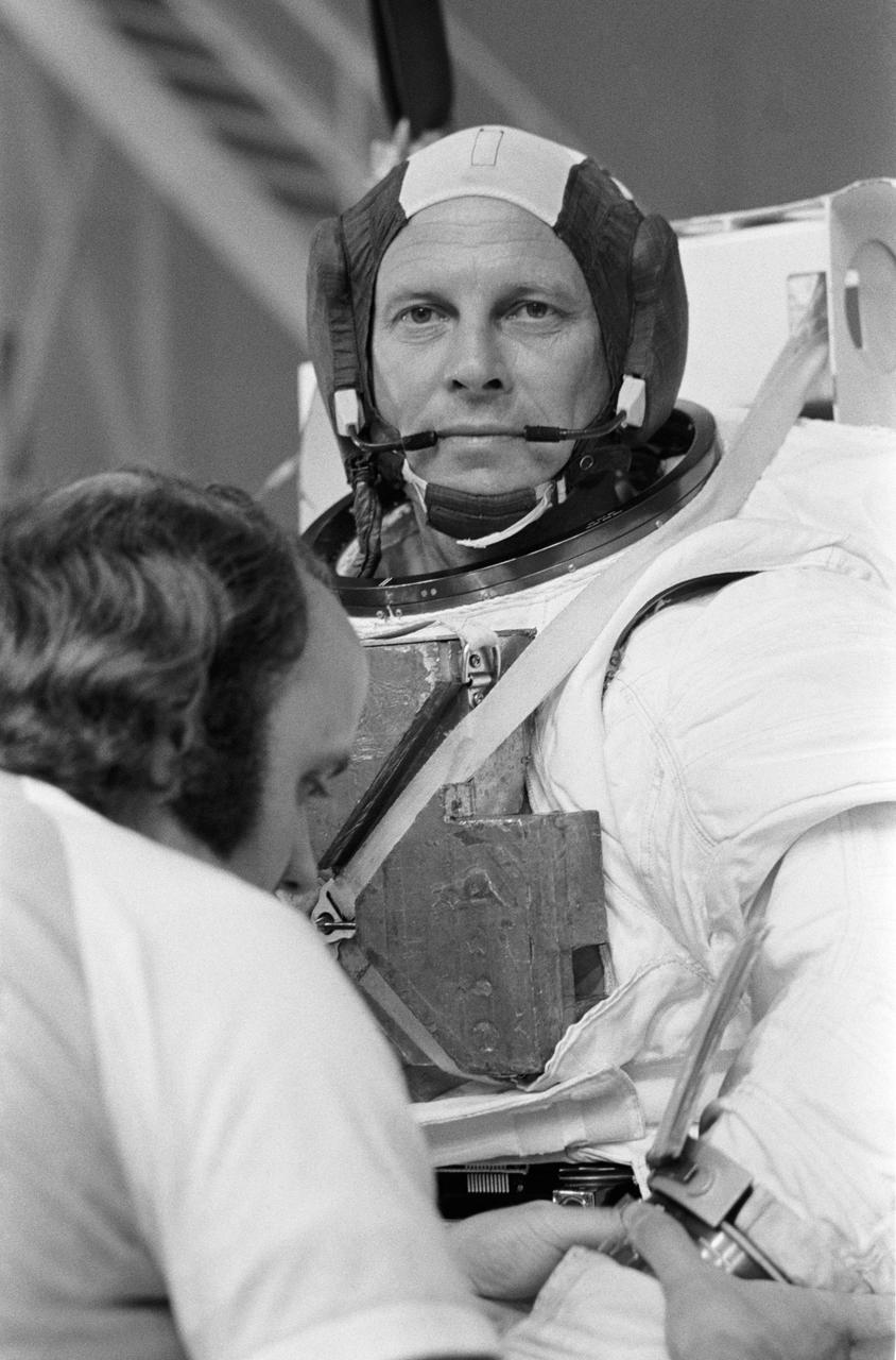 Portrait view of astronaut Jack Lousma in the Extravehicular Mobility Unit (EMU) at bldg 29 Weightless Environment Training Facility (WETF). He is wearing the EMU minus the helmet.