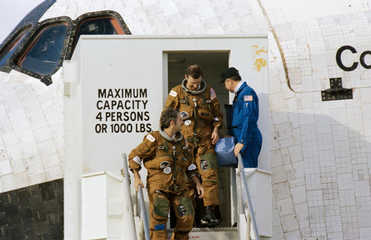 Documentary views of Space Shuttle Columbia on Lakebed Runway during De-Servicing, Crew Egress and departure from Orbiter at the end of STS-2 Mission. EAFB, CA Also available in 70 CN
